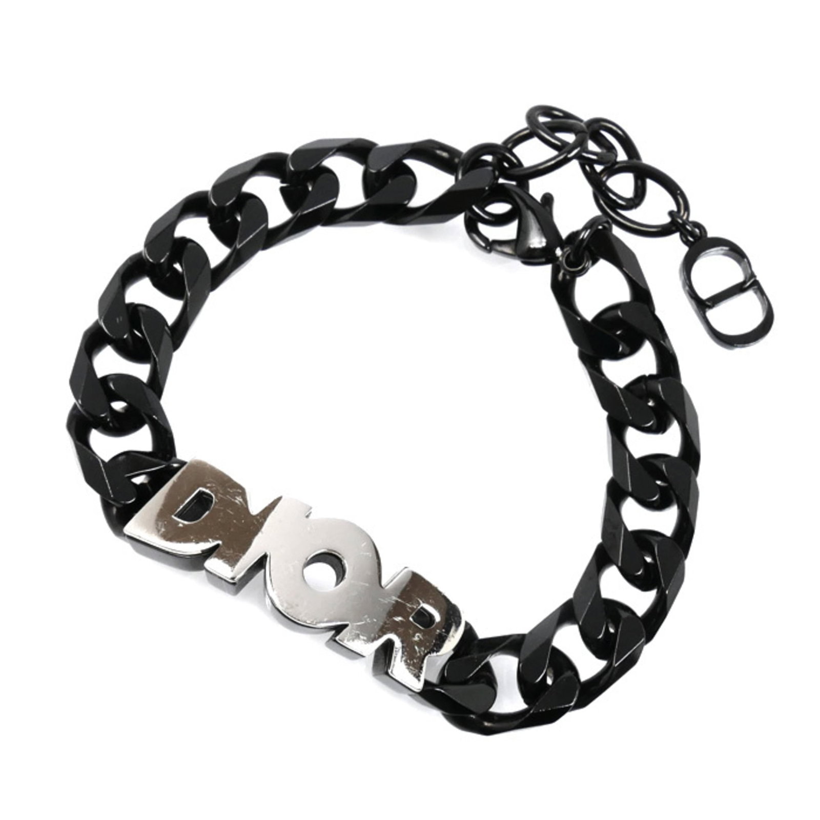 Link bracelet metal by Christian Dior: Link bracelet metal by Christian Dior Black and silver link bracelet from Christian Dior, available in lengths ranging from 16.5cm to 20.5cm. This metal piece features a sleek design with a classic