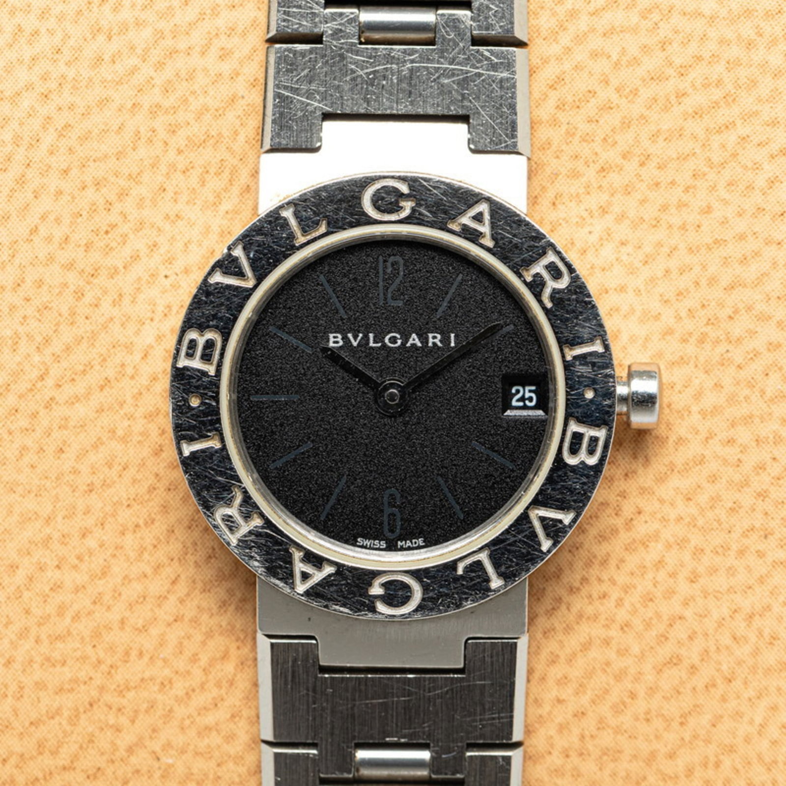 Bvlgari Wristwatch: Bvlgari Wristwatch Stainless steel case and band provide a sleek, modern look for the Bvlgari wristwatch. The black dial stands out against the silver case, while quartz movement ensures reliable