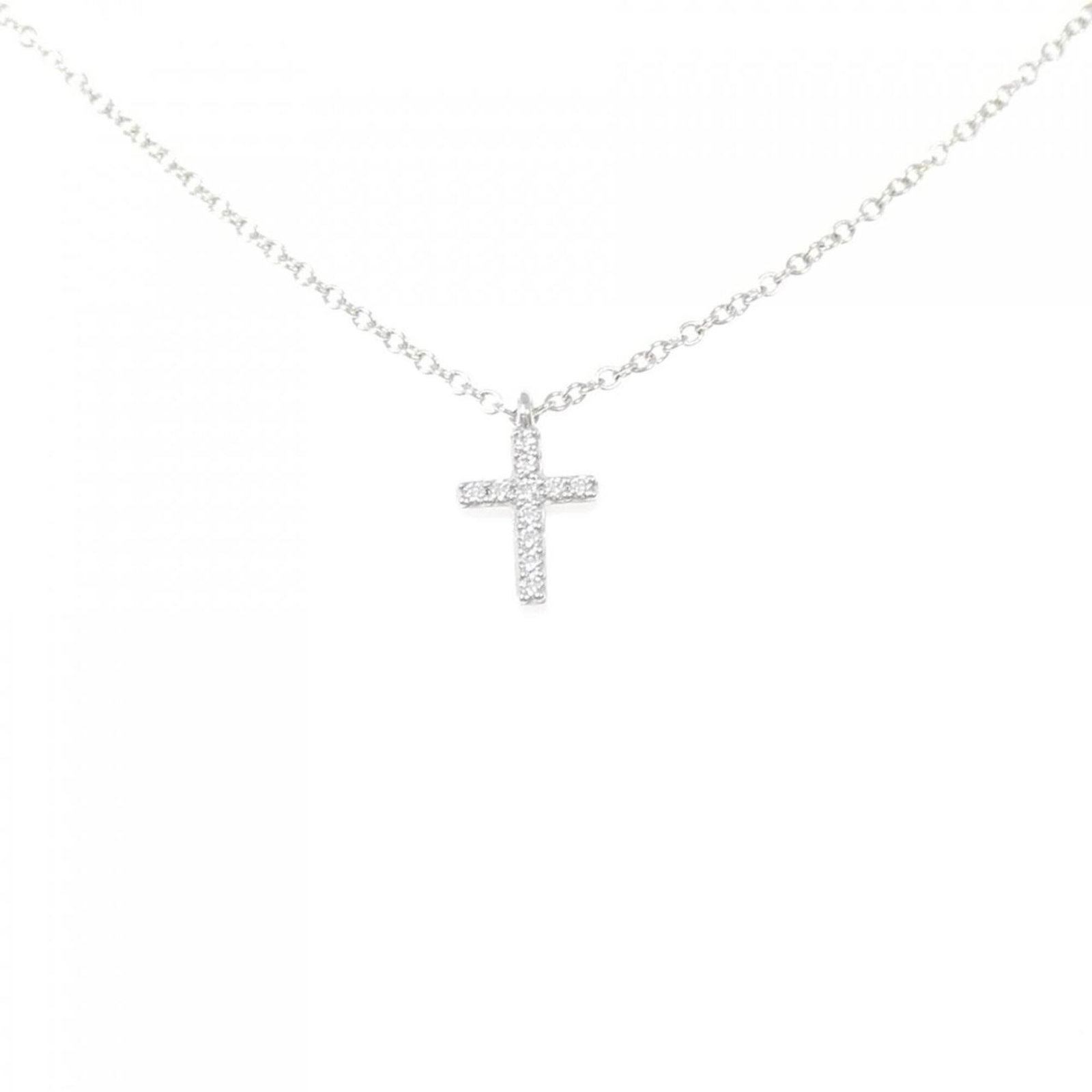 Metro Cross Tiffany Necklace Mini: Metro Cross Tiffany Necklace Mini White gold (18K) pendant features a diamond, set in a classic design. The necklace measures 41 cm in circumference and the pendant itself is 9.7mm x 5.9mm in size.