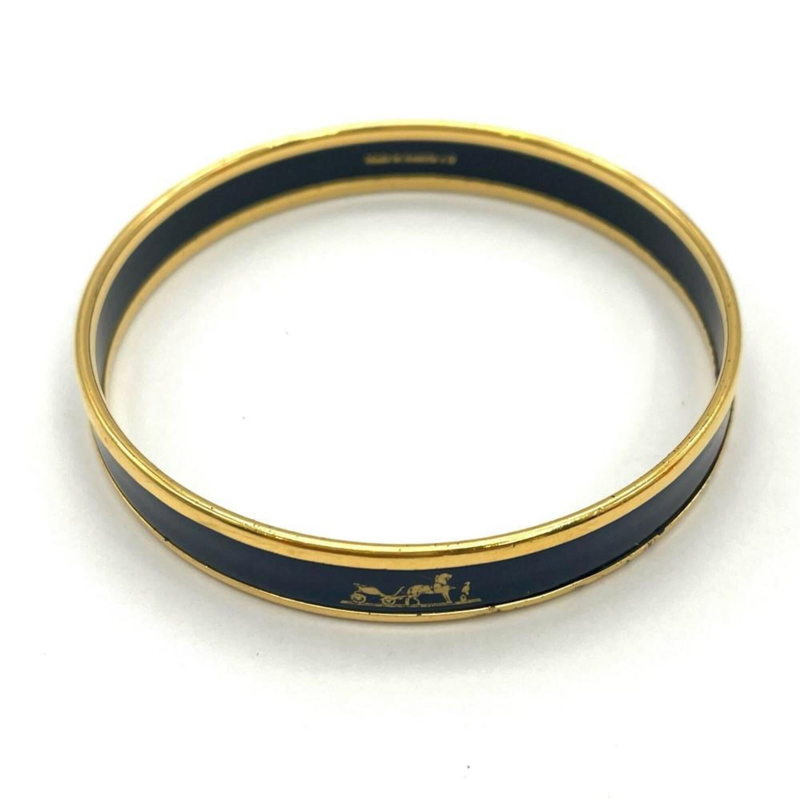 Metal Bangle Hermes: Metal Bangle Hermes Metal Bangle by Hermes, made from enamel and metal, measures 19.5cm in length. This bangle features a notable design that stands out due to its unique combination of materials and