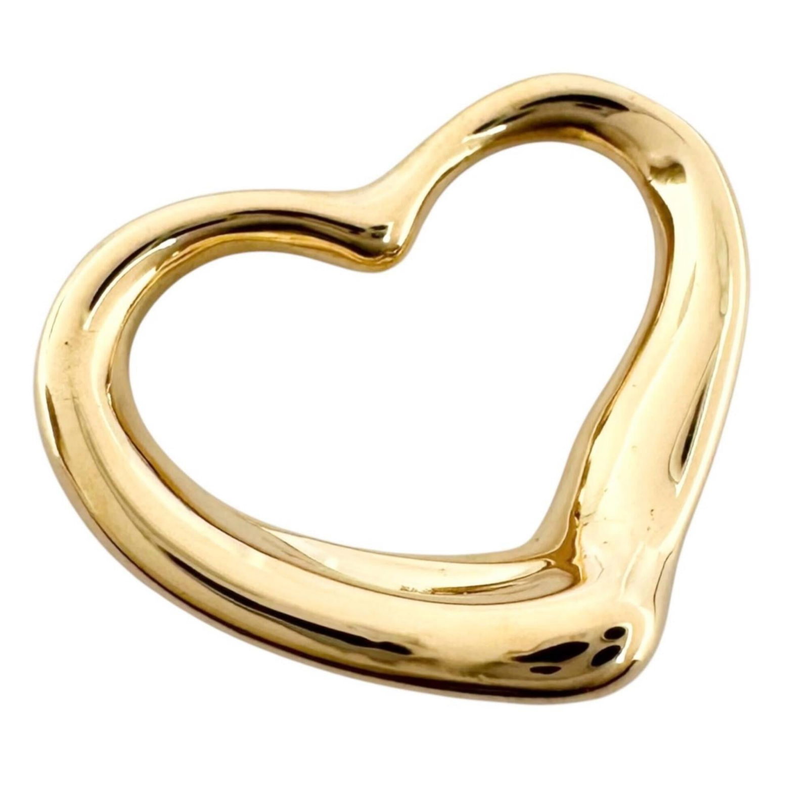 Peretti Elsa Tiffany Top 18K Gold Pendant Women's Open Heart: Peretti Elsa Tiffany Top 18K Gold Pendant Women's Open Heart 18K gold pendant in an open heart design, measuring 12mm x 15mm. The Tiffany brand adds a touch of elegance to any outfit with its classic