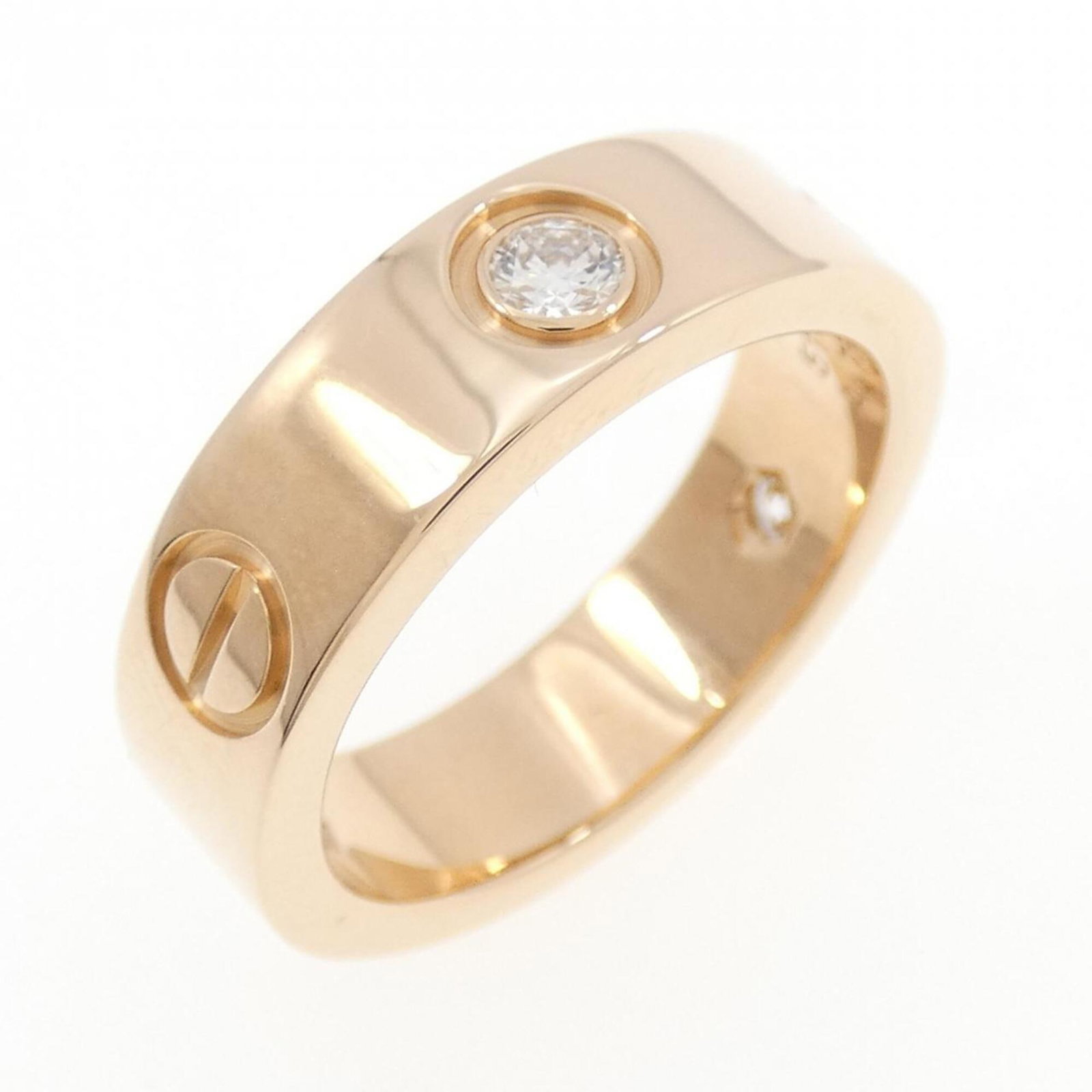 Pink Gold Ring Band Cartier: Pink Gold Ring Band Cartier Pink gold (18K) band ring from Cartier, featuring a diamond stone and a size 6 fit. This elegant piece showcases the luxury brand's signature style. The pink gold material