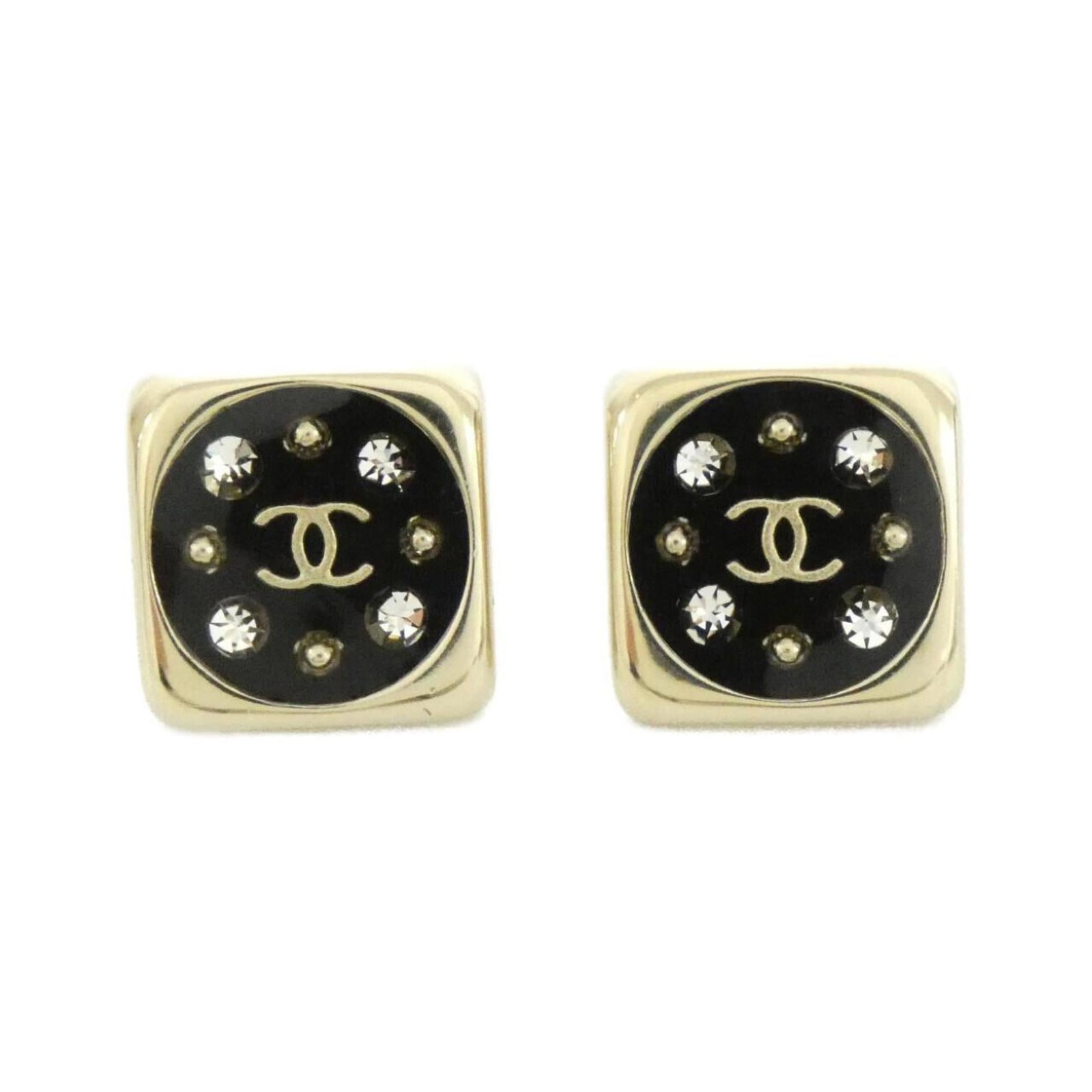 Chanel Stud Earrings: Chanel Stud Earrings Studs adorned with crystal, these black and gold Chanel earrings are a sleek addition to any outfit. Measuring 17mm in diameter, they showcase the brand's signature style. The AB7