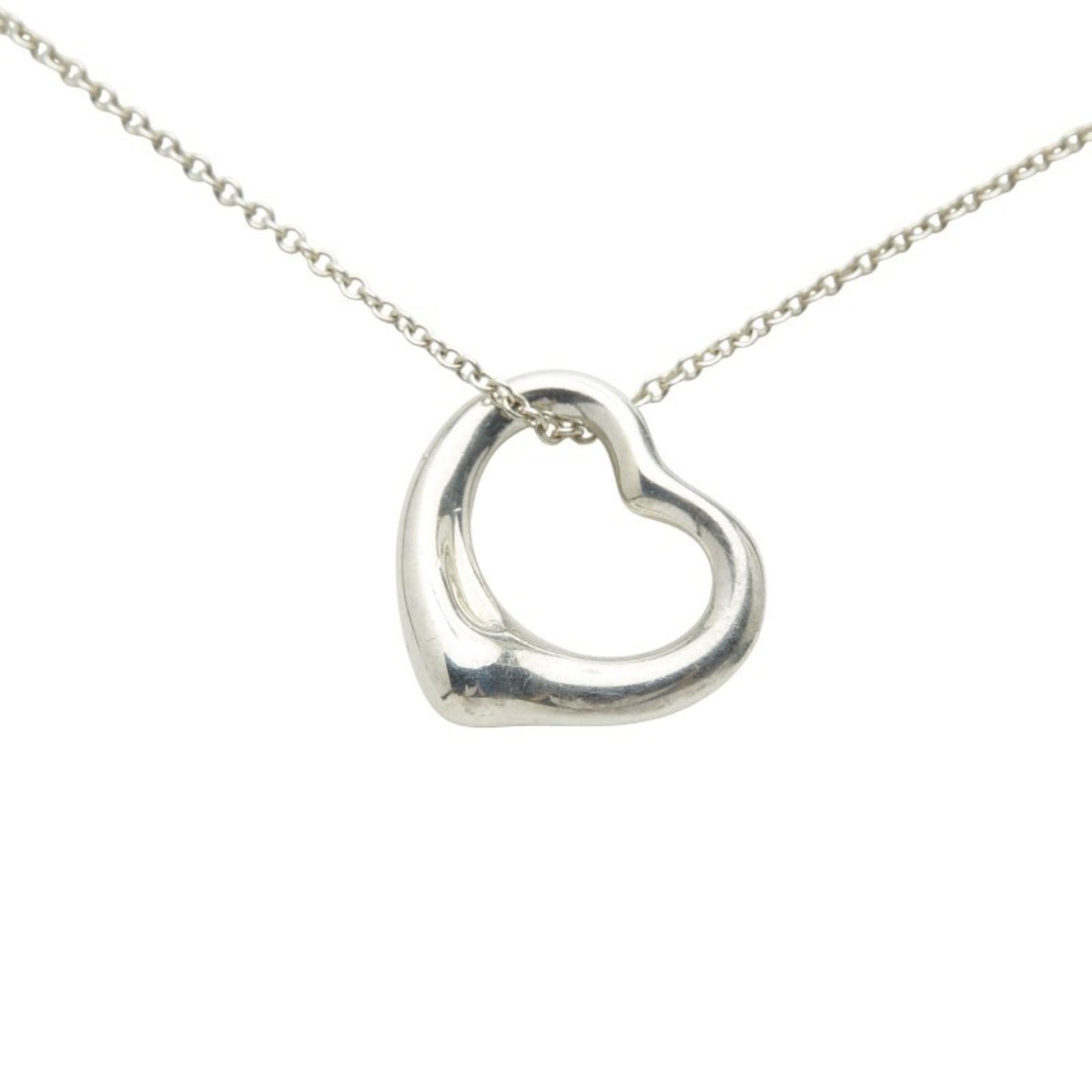 Tiffany & Co. Open Heart Necklace In 925 Sterling Silver For Women.: Tiffany & Co. Open Heart Necklace In 925 Sterling Silver For Women. Tiffany & Co. Open Heart Necklace in sterling silver offers a sleek and elegant design, featuring an open heart pendant with a class