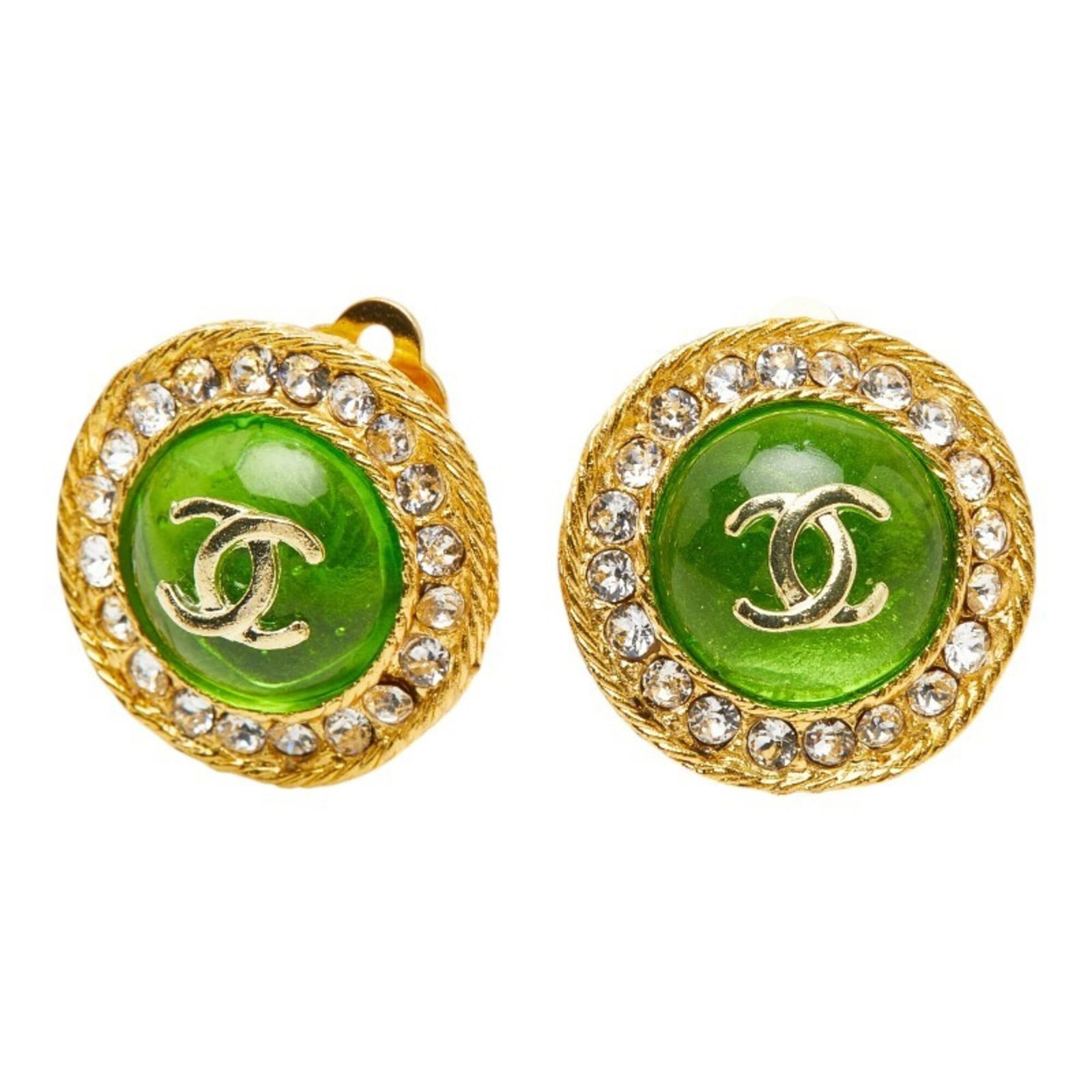 Clip earrings by Chanel: Clip earrings by Chanel Gold clip earrings by Chanel feature rhinestone accents in green, adding a touch of elegance to any outfit. Measuring 22.50mm x 22.50mm, these vintage earrings are a compact ye