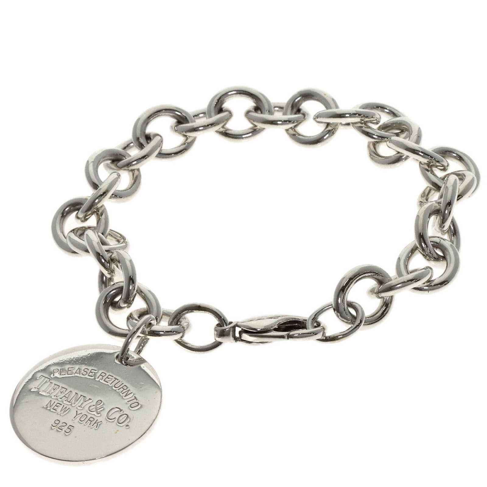 Silver Charm Bracelet by Tiffany: Silver Charm Bracelet by Tiffany Silver Charm Bracelet by Tiffany. This sterling silver charm bracelet boasts a sleek design, measuring 17cm in length. The intricate details and classic style make it 