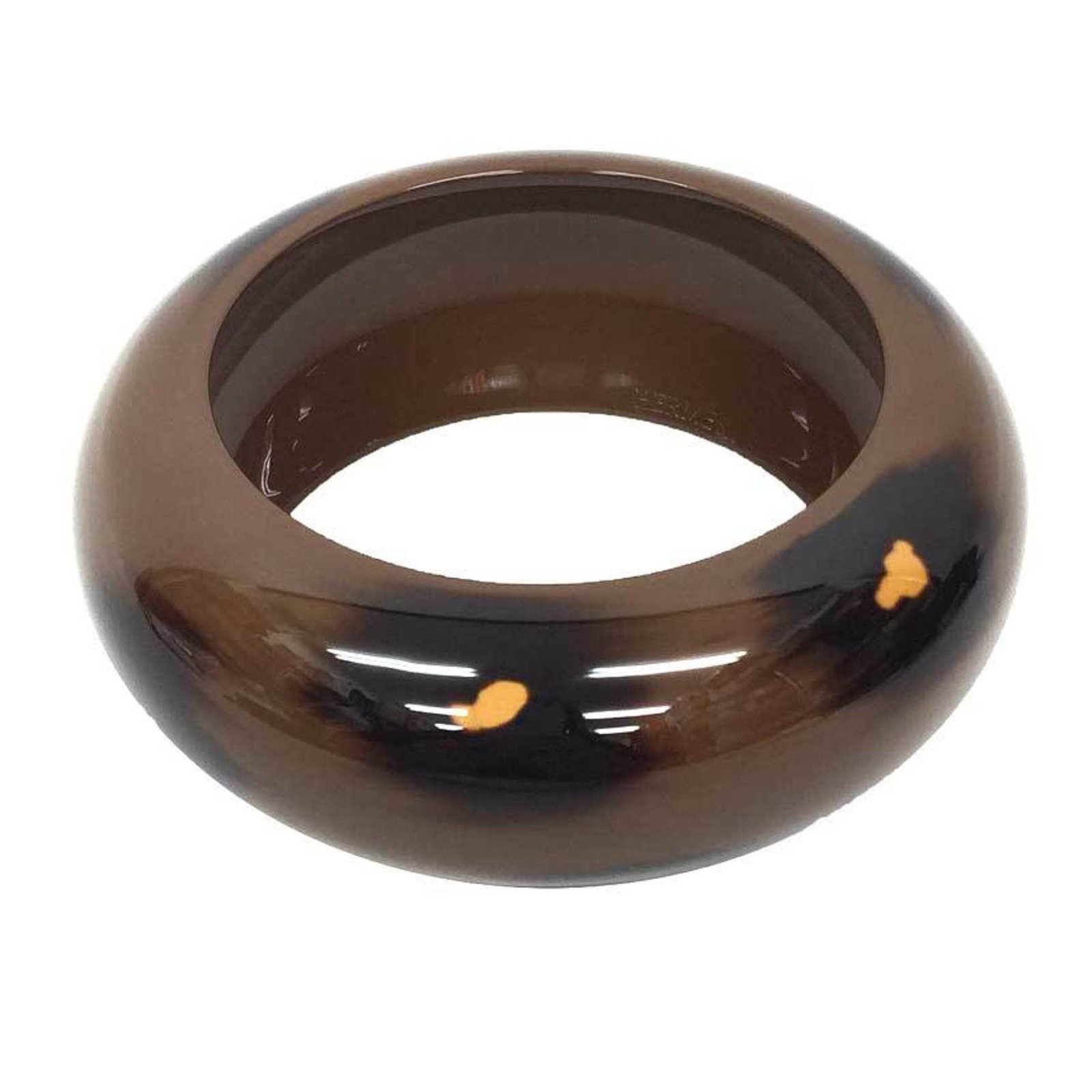 Lacquer wood bangle from Hermes: Lacquer wood bangle from Hermes Lacquer wood bangles from Hermes feature a rich brown color and are presented in a dust bag. The item's material and design showcase the brand's attention to detail, wh