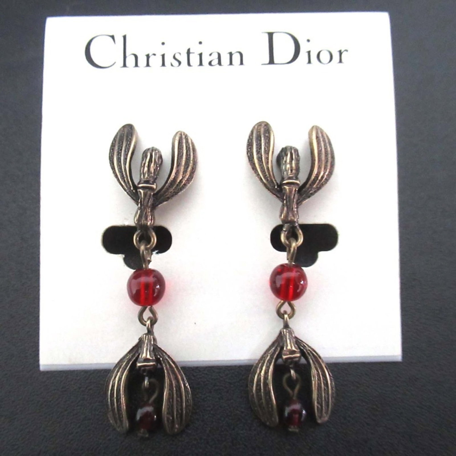 Clip earrings by Christian Dior: Clip earrings by Christian Dior Clip earrings by Christian Dior, featuring a gold frame and color stone. Measuring 45mm x 13mm, these elegant accessories showcase the brand's signature style. Made