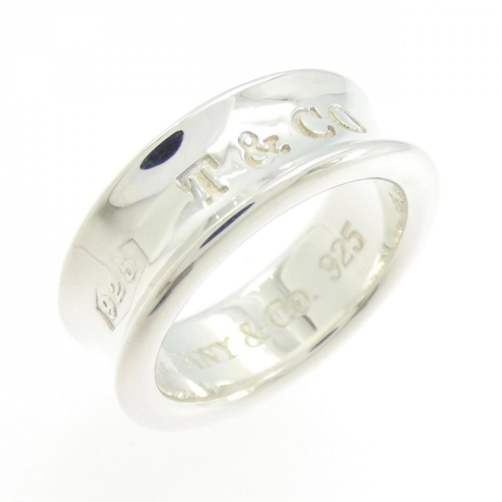 Silver 925 Tiffany Band Ring: Silver 925 Tiffany Band Ring Silver 925 Tiffany Band Ring, available in US Size 5 and JP Size 9.0, features a high-quality silver band with a notable Tiffany hallmark. This ring bears the signature
