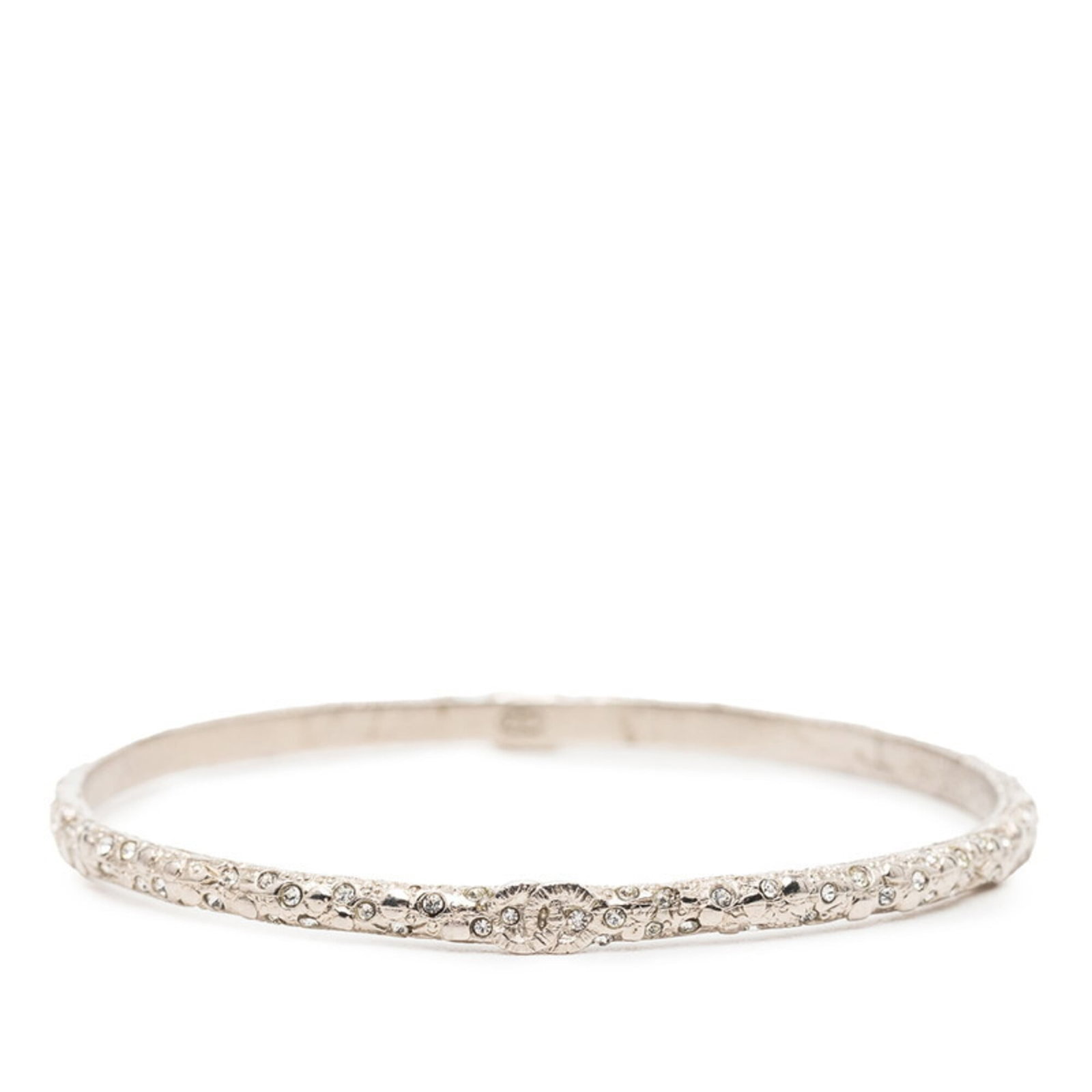 Chanel Bangle Metal Rhinestone: Chanel Bangle Metal Rhinestone Silver Chanel Bangle with Rhinestones measures 19.5cm in length, featuring metal and rhinestone materials. This bangle showcases a notable design element with its promin