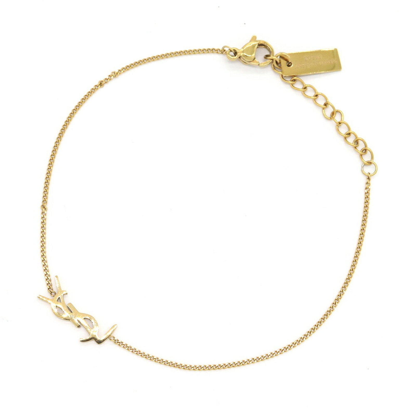 Saint Laurent Metal Charm Bracelet: Saint Laurent Metal Charm Bracelet Gold charm bracelet from Saint Laurent, featuring a metal design with a signature and measuring 19cm in length. The delicate charm bears a sizeable stone, adding