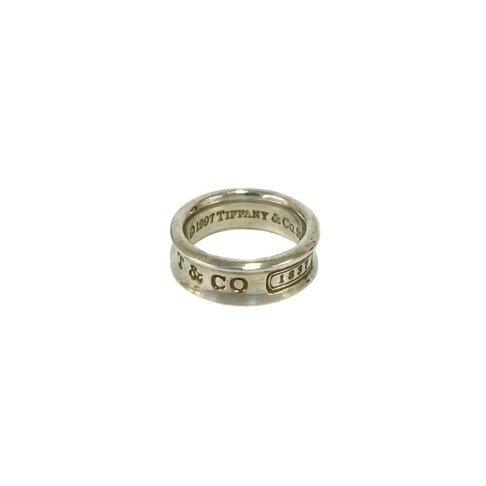 Silver 925 Tiffany Band Ring: Silver 925 Tiffany Band Ring Silver 925 Tiffany Band Ring, available in US size 5 and Japanese size 9. This elegant band ring features sterling silver material and a classic design that suits women's