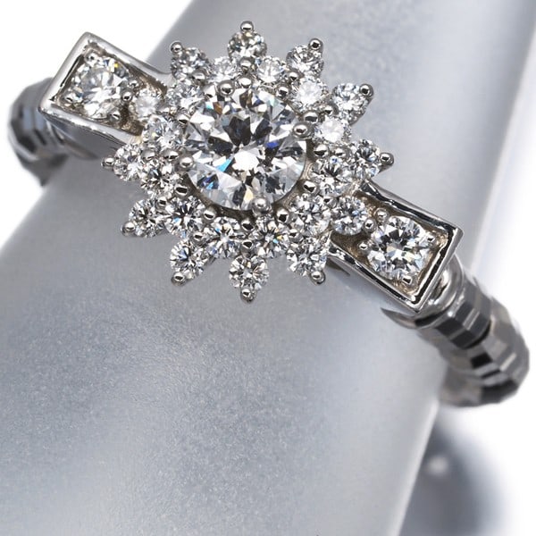 Diamond 0.26Ct/ 0.28Ct Flower One Size Fits All Ring 950 Platinum: Diamond 0.26Ct/ 0.28Ct Flower One Size Fits All Ring 950 Platinum 950 Platinum flower ring featuring a natural diamond centre stone weighing 0.26ct and side stones totaling 0.28ct, set in a platinum