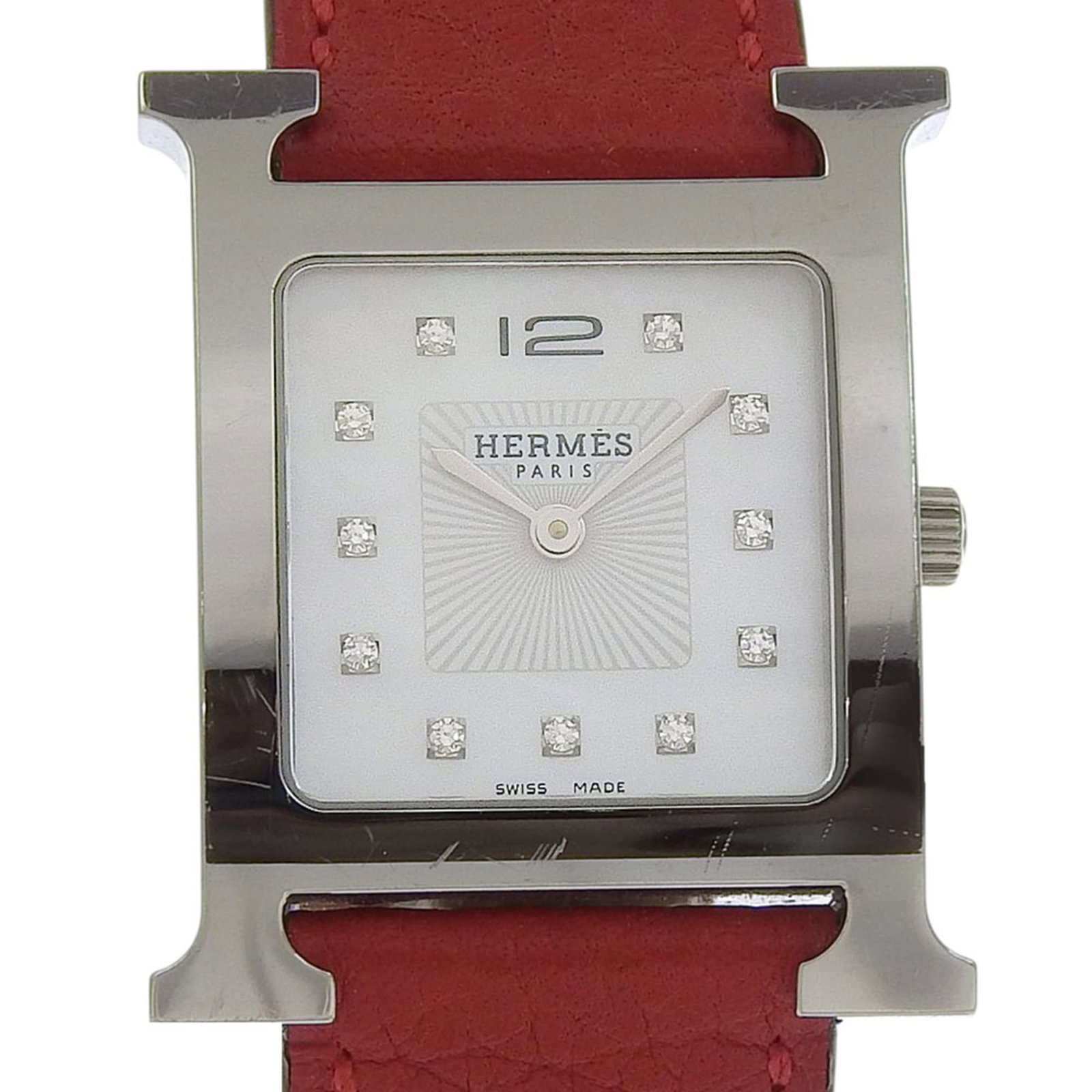 Hermes Wristwatch: Hermes Wristwatch Stainless steel case with a sleek white shell dial, adorned with a diamond gemstone, and paired with a supple leather band, this Hermes Heure H wristwatch exudes understated elegance
