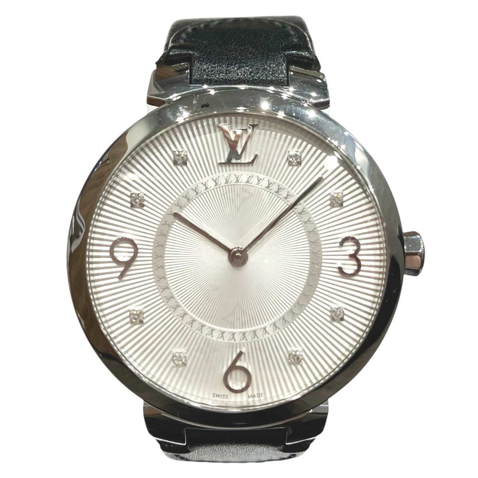 Louis Vuitton Wristwatch: Louis Vuitton Wristwatch Stainless steel case and silver dial make for a sleek, modern design. The watch features a leather band, complementing the metal case with a touch of elegance. With its