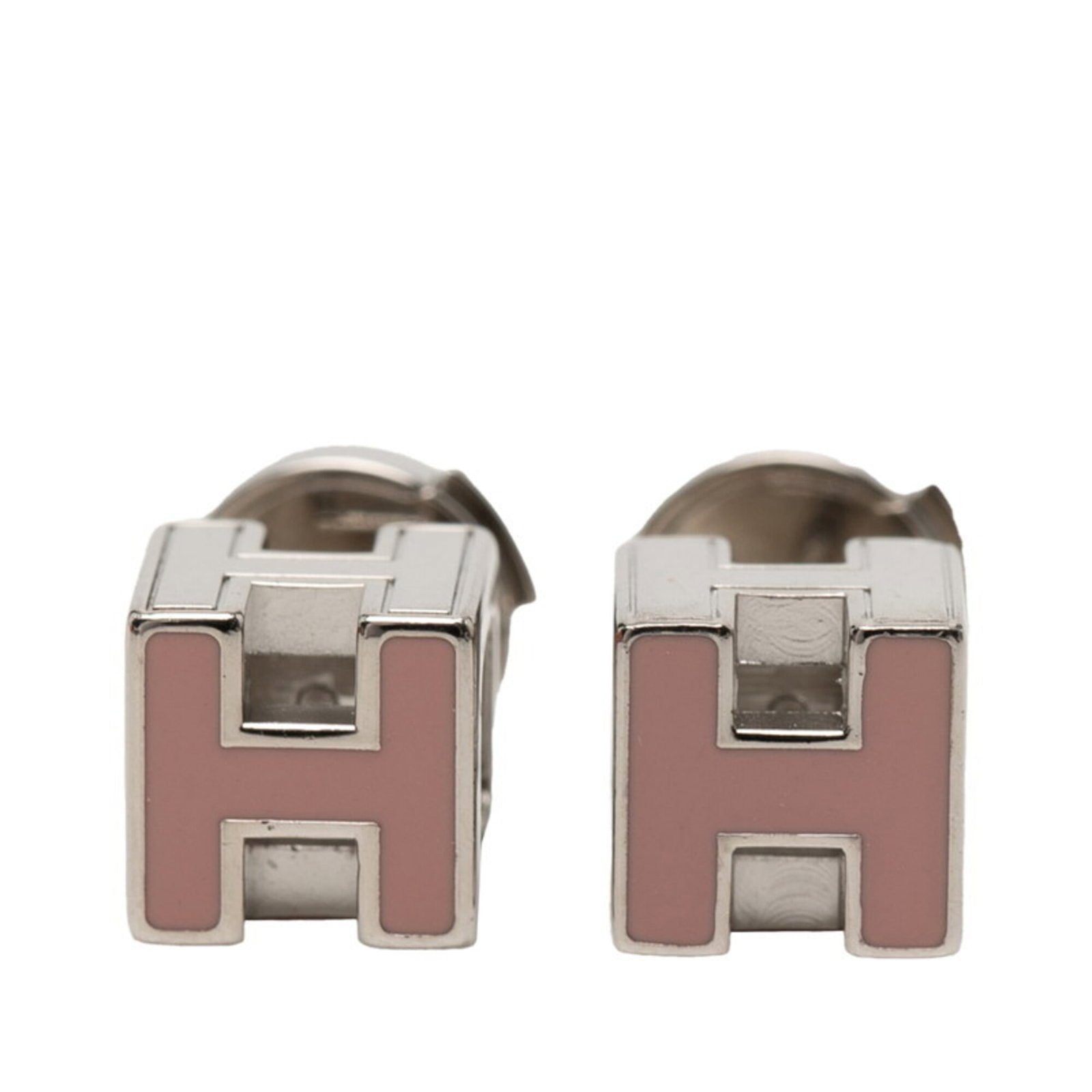 Metal enamel earrings by Hermes: Metal enamel earrings by Hermes Stud earrings featuring vibrant pink enamel, set against a silver metal base. The intricate design showcases the signature style of Hermes, renowned for its