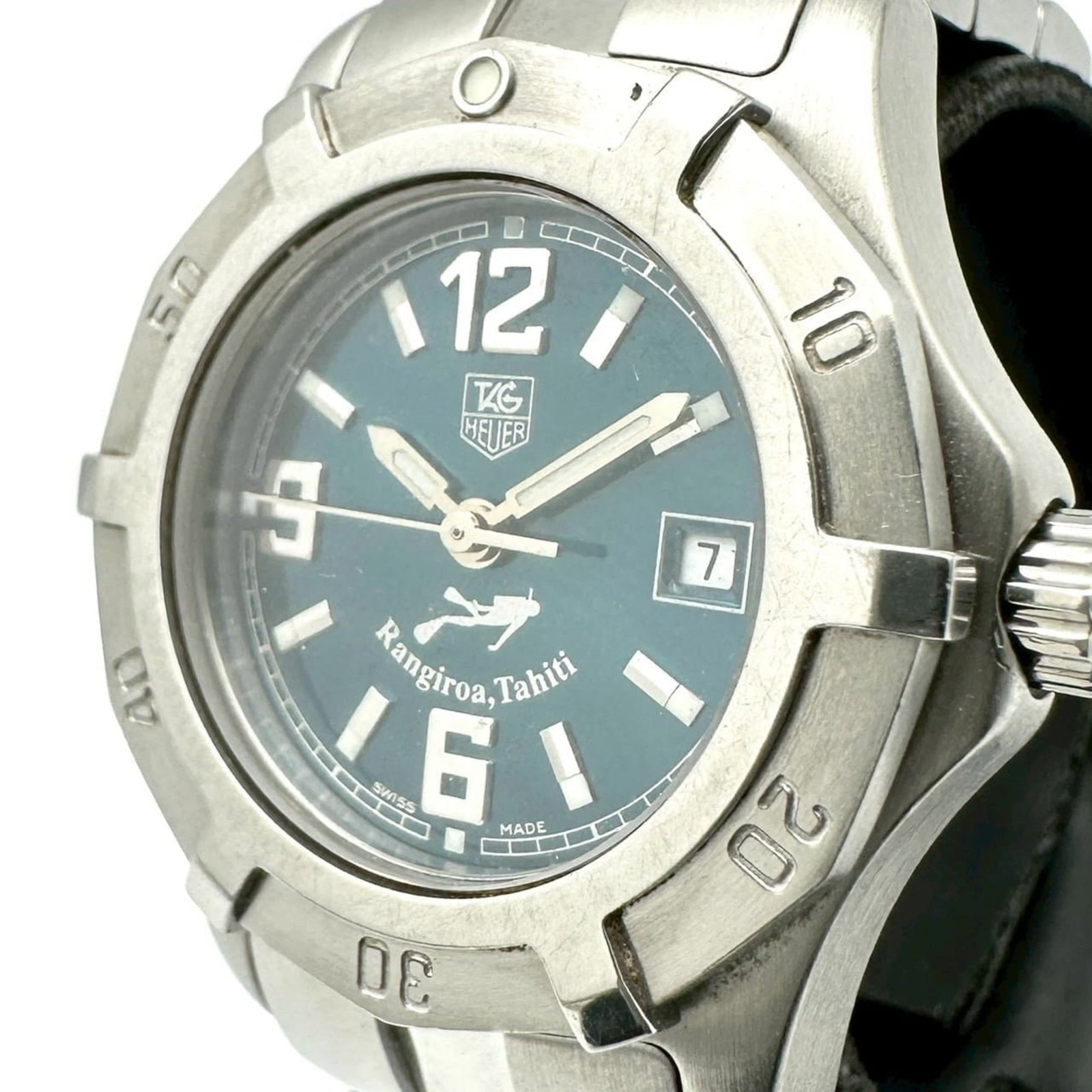 Wristwatch From Tag: Wristwatch From Tag Stainless steel case and band, green dial, and quartz movement make for a sleek and functional timepiece. This Tag Heuer women's wristwatch boasts a compact 28mm size with an