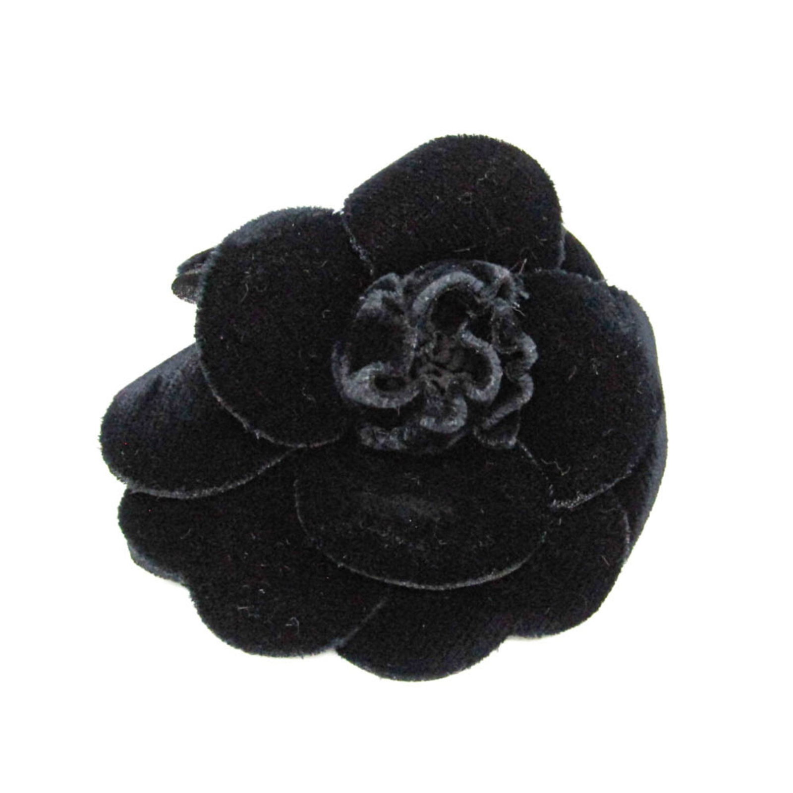 Velvet brooch Chanel: Velvet brooch Chanel The sleek and sophisticated velvet brooch from Chanel's Camellia line boasts a striking black color and luxurious velvet material. Measuring 9cm x 9cm, its compact size belies the