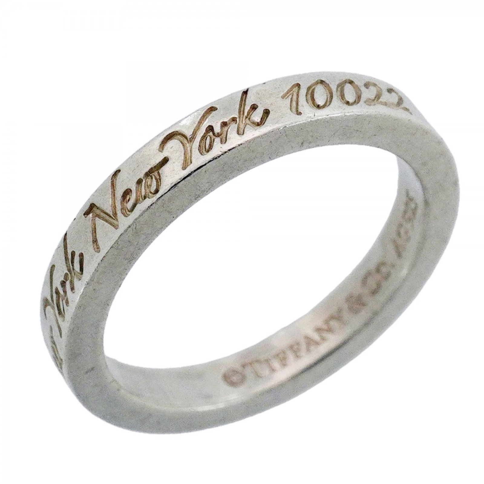 Silver 925 Tiffany Band Ring: Silver 925 Tiffany Band Ring Silver 925 Tiffany Band Ring features a classic design with a silver 925 material and US size 5, suitable for women. The ring bears the JP size 9 marking, indicating its