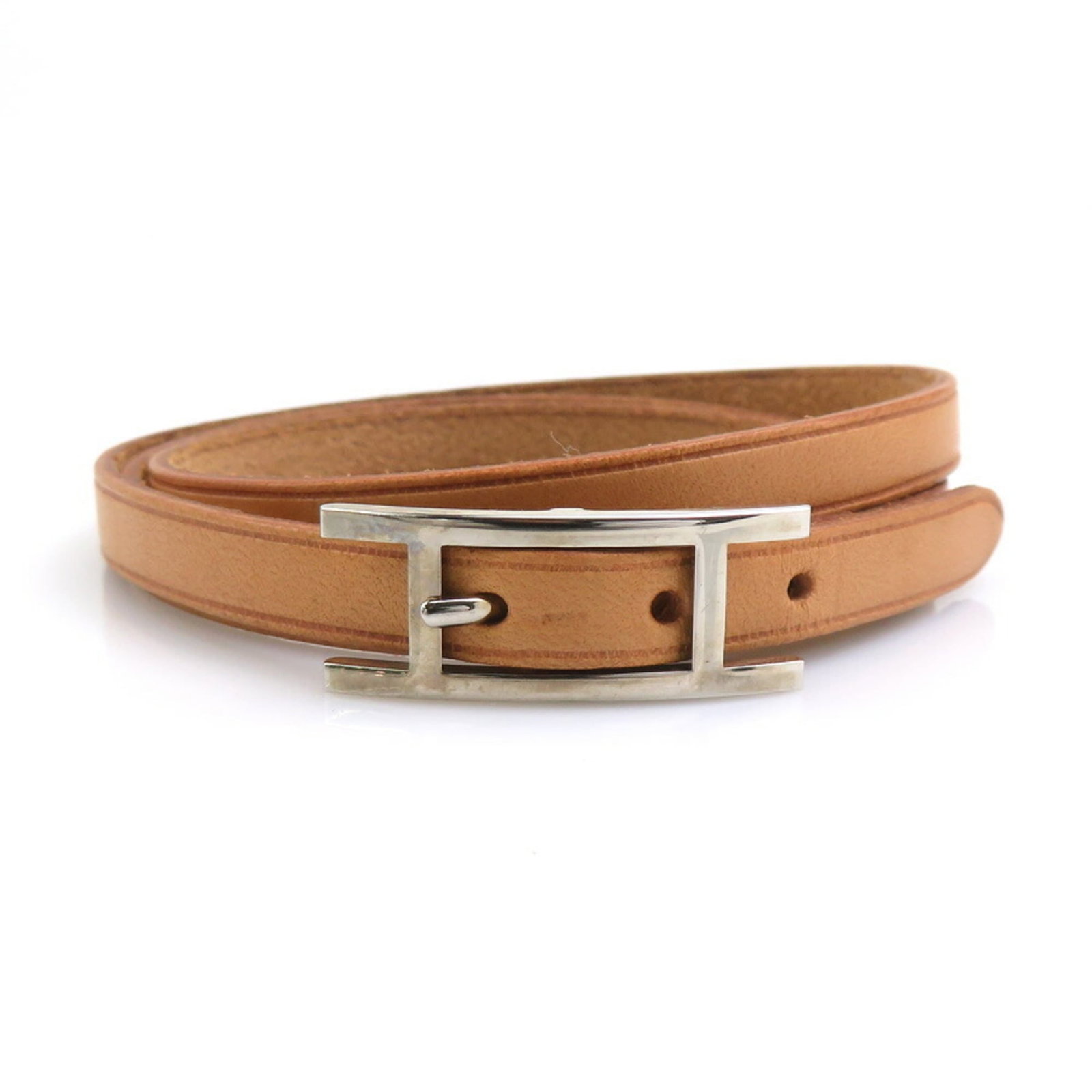 Metal leather bracelet charm by Hermes: Metal leather bracelet charm by Hermes Metal leather bracelet charm by Hermes, featuring beige brown and silver tones, with a classic design. This 72.5cm long, 2.5cm wide charm bracelet boasts a