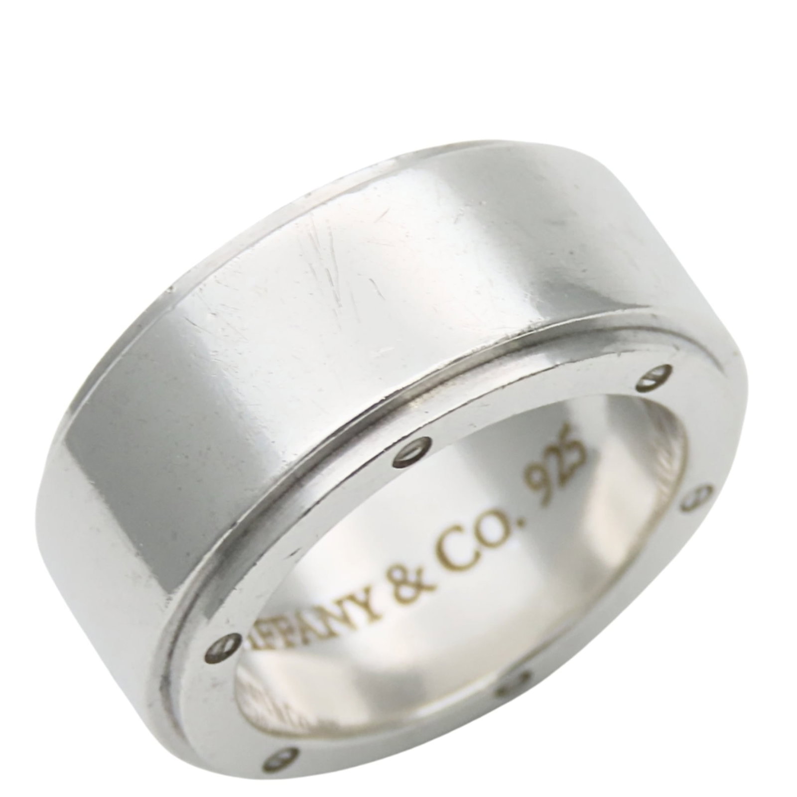 Silver 925 Tiffany Band Ring: Silver 925 Tiffany Band Ring Silver 925 Tiffany Band Ring - A classic silver band ring from the renowned Tiffany brand, featuring a timeless design in sterling silver (925). This US size 5 and
