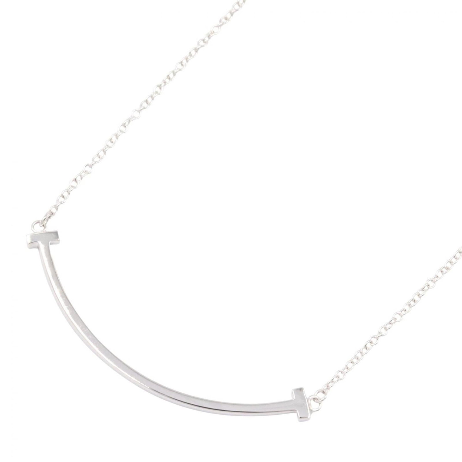 Tiffany & Co. T Smile Small Necklace 18K White Gold (18Kwg) Women'S Silver Tone 60011677: Tiffany & Co. T Smile Small Necklace 18K White Gold (18Kwg) Women'S Silver Tone 60011677 Tiffany & Co. T Smile Small Necklace in 18K White Gold features a delicate 3mm x 37mm pendant suspended from