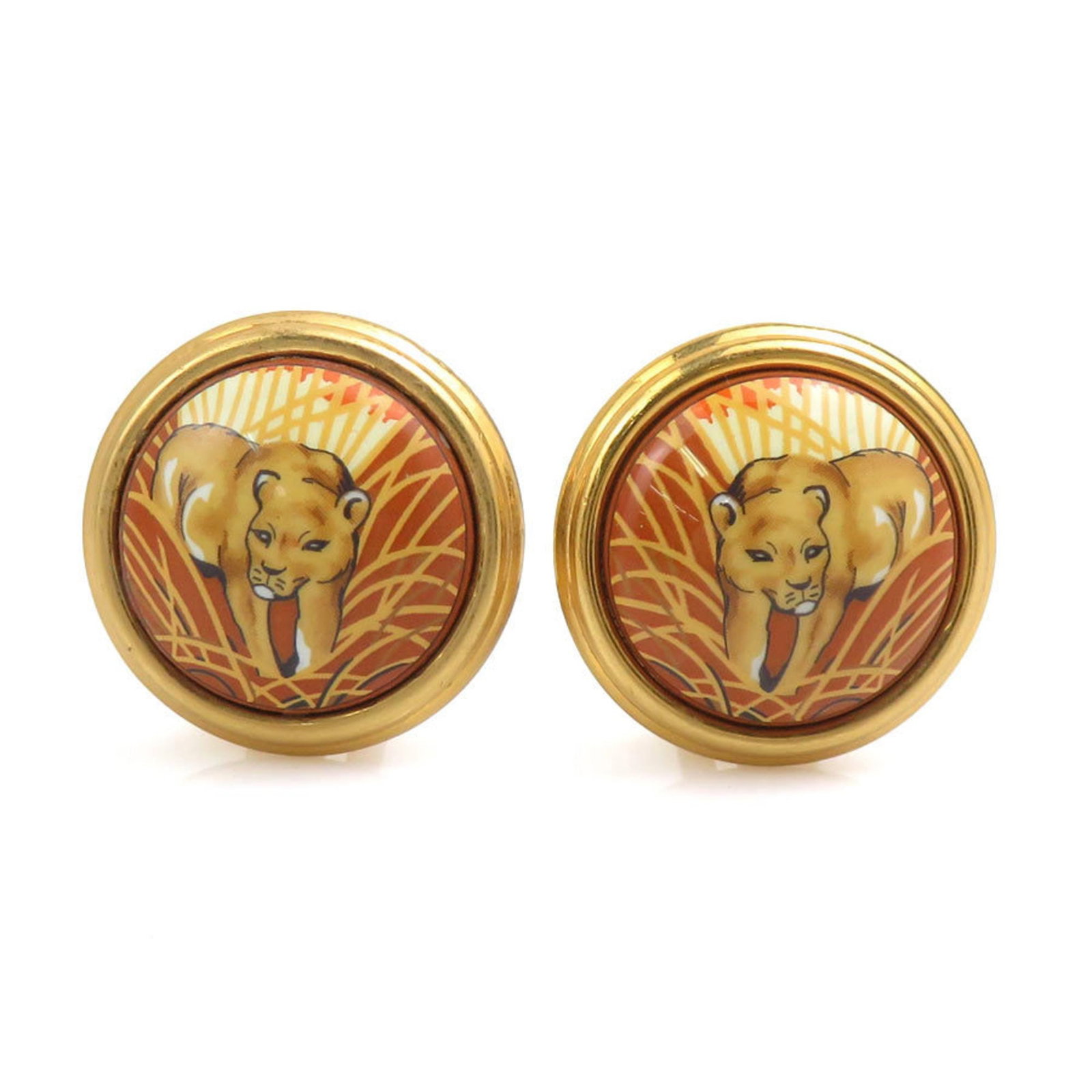 Hermes Clip Earrings Metal: Hermes Clip Earrings Metal Brown and gold metal clip earrings from Hermes. Made with high-quality metal, these elegant earrings feature a classic design. Perfect for adding a touch of luxury to any