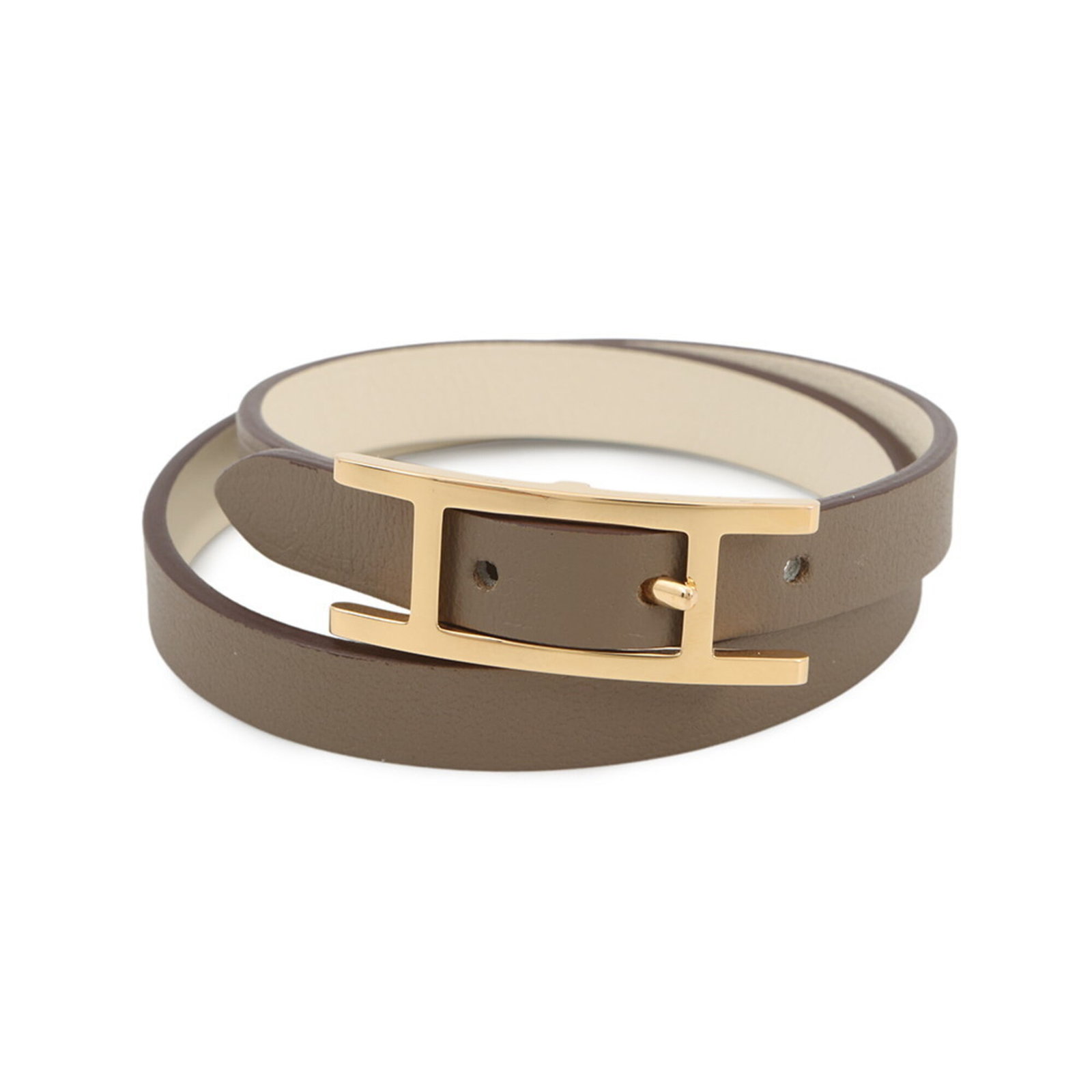 Swift Leather bracelet by Hermes: Swift Leather bracelet by Hermes Swift Leather bracelet by Hermes features high-quality Swift leather in Etoupe gray, crafted into a classic link design. Measuring 14.5cm - 16cm, this elegant bracelet