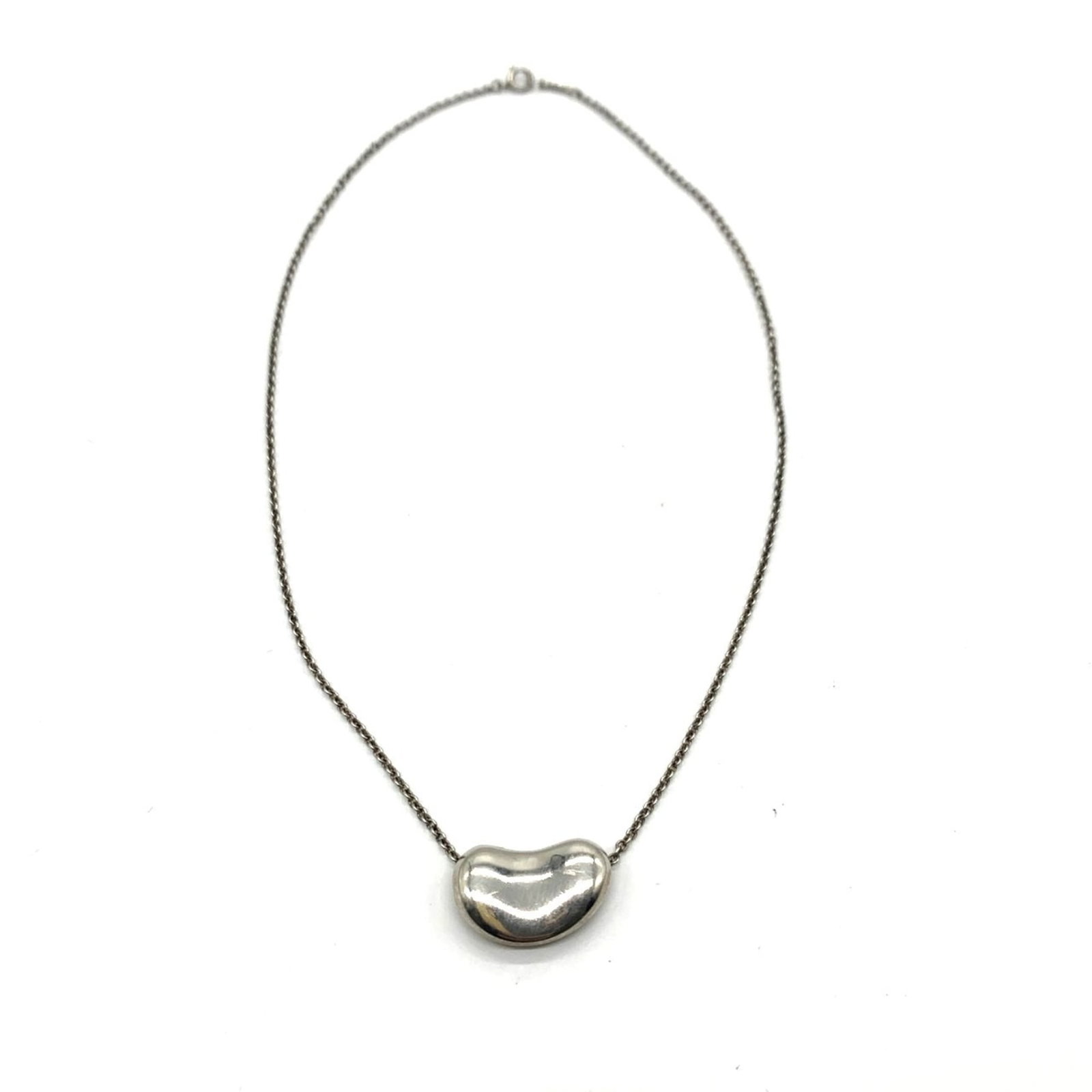 Women's silver beans necklace by Tiffany Sv925: Women's silver beans necklace by Tiffany Sv925 Silver pendant measures 1.2mm x 20mm, set in a necklace with a circumference of 39 cm / 15.35''. The necklace itself weighs 10.7g / 0.37oz and is made