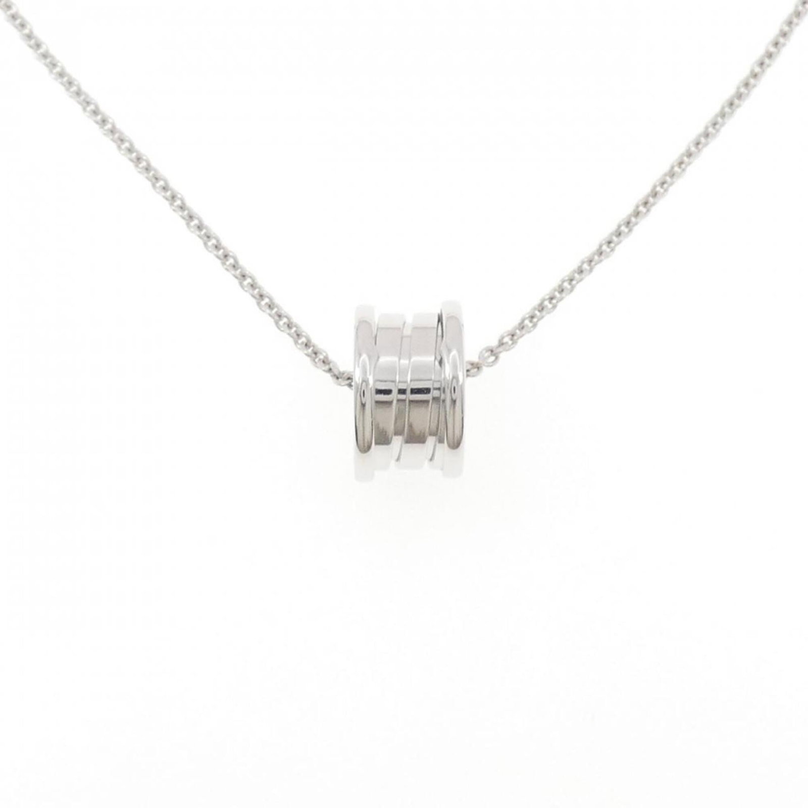 B Zero1 by Bvlgari Necklace: B Zero1 by Bvlgari Necklace White gold (18K) pendant on a chain necklace from Bvlgari, featuring a pendant size of 14.8mm x 8.8mm. The necklace has a neck circumference of 40 cm and is made with