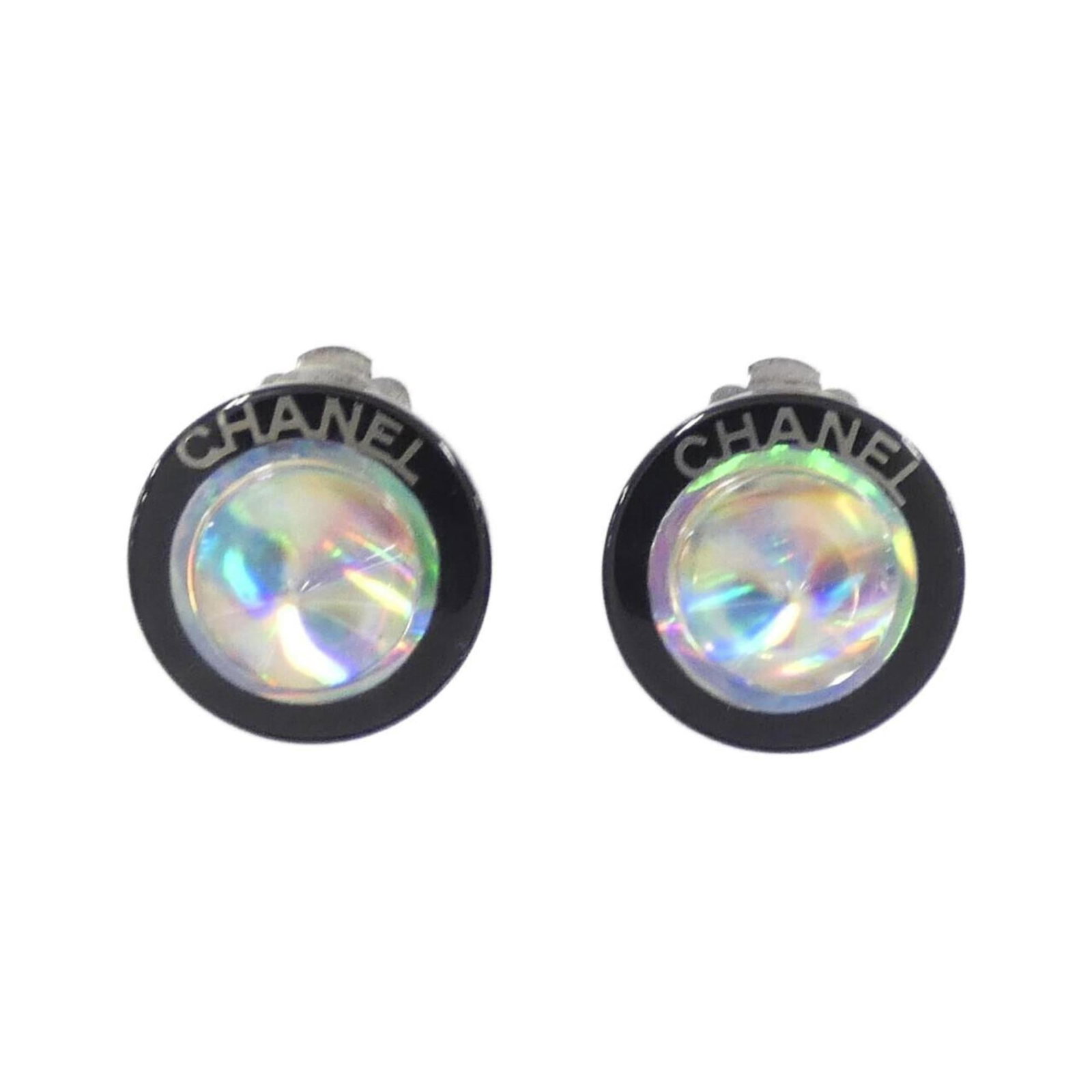 Clip earrings by Chanel: Clip earrings by Chanel Clip earrings by Chanel, available in black, clear, and silver finishes, feature a sleek design with precise dimensions of 18.00mm x 18.00mm. The item comes in a sturdy box