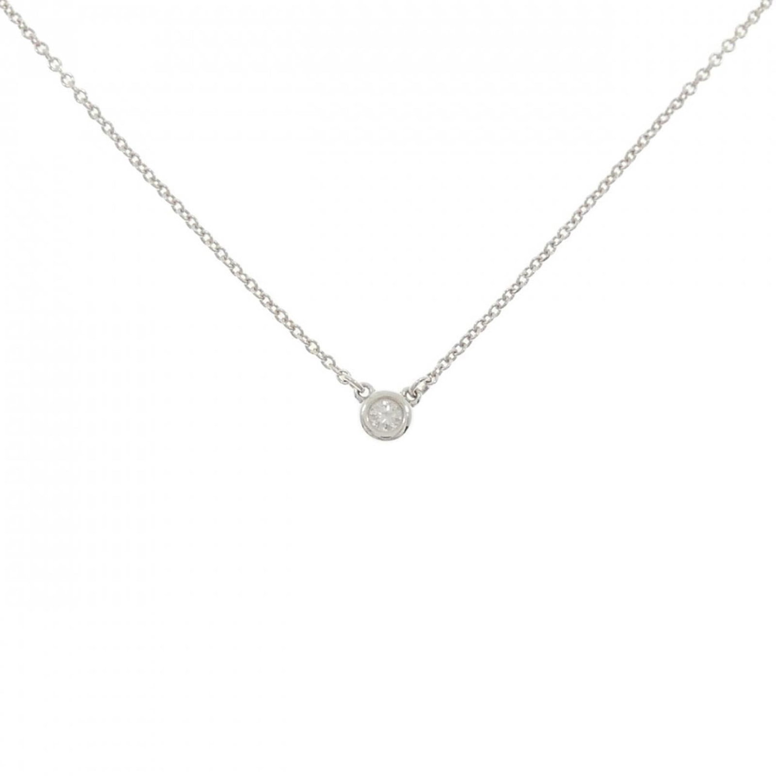 By Tiffany Yard Necklace: By Tiffany Yard Necklace The By Tiffany Yard Necklace boasts a stunning silver 925 setting, adorned with a beautiful diamond stone. Its sleek design and elegant silver color make it a sophisticated ac