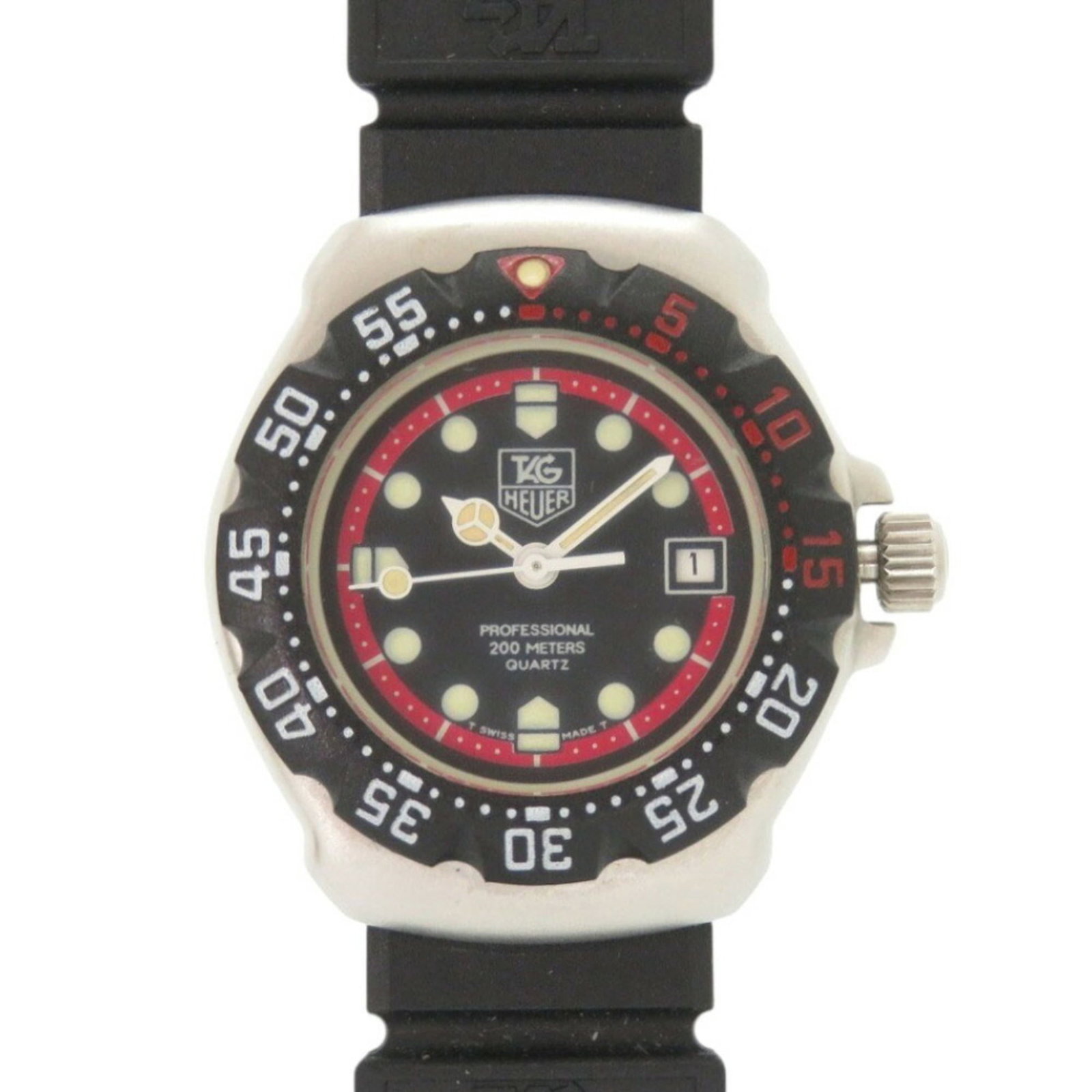 Wristwatch From Tag: Wristwatch From Tag Stainless steel and rubber combine in this sleek Tag Heuer women's wristwatch, featuring an analog display and black dial. The quartz movement powers a compact case with a