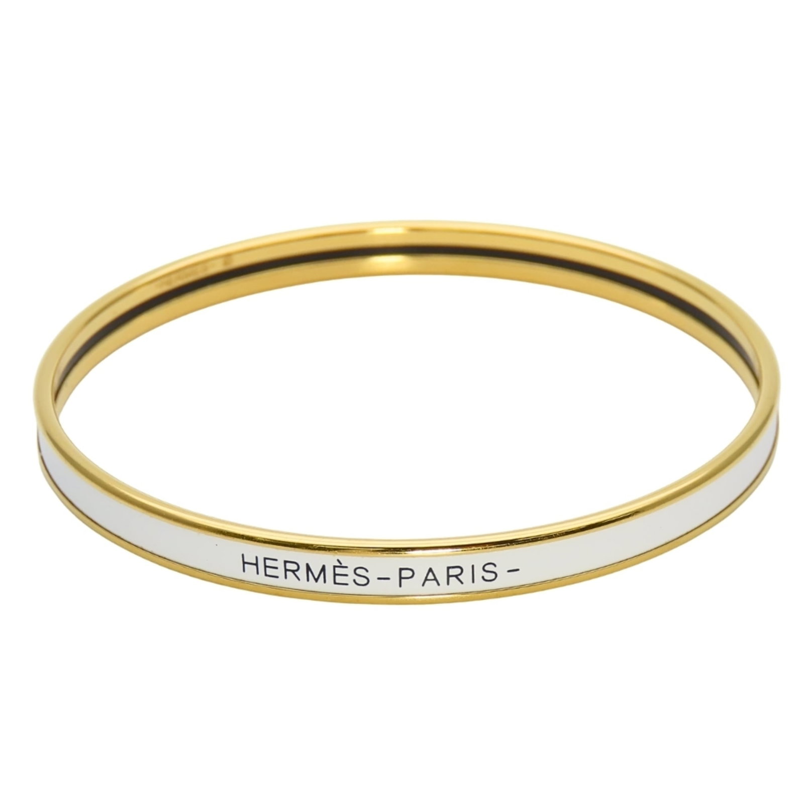 Metal enamel charm bracelet by Hermes: Metal enamel charm bracelet by Hermes Gold and white enamel details adorn this metal charm bracelet by Hermes, measuring 19.5cm in length and featuring a width of 5mm. The weight of the item is