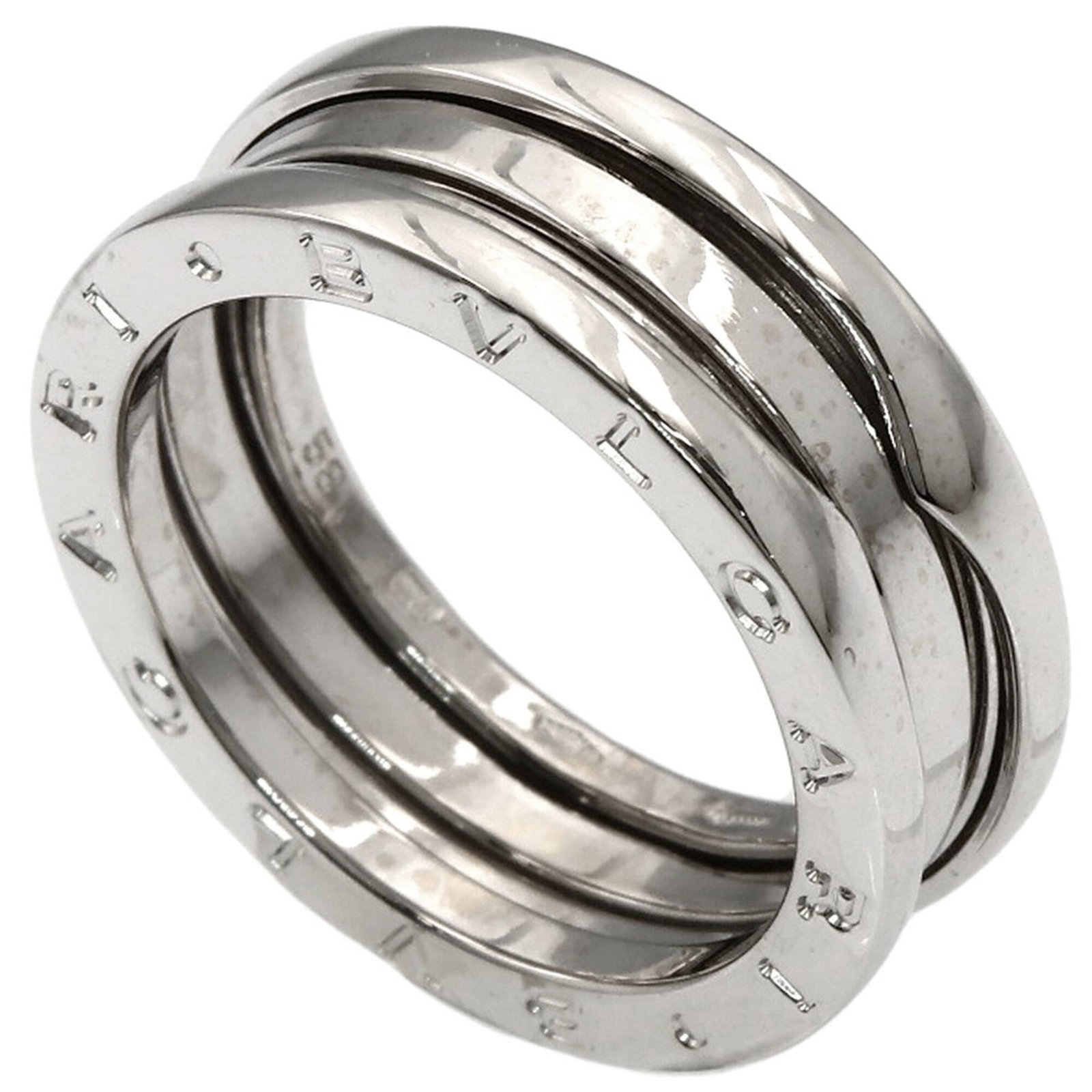 Bvlgari Band Ring White Gold (18K): Bvlgari Band Ring White Gold (18K) Bvlgari Band Ring White Gold (18K) - A sleek and sophisticated band ring in white gold, featuring the iconic B.zero1 style. This 18K white gold piece is available
