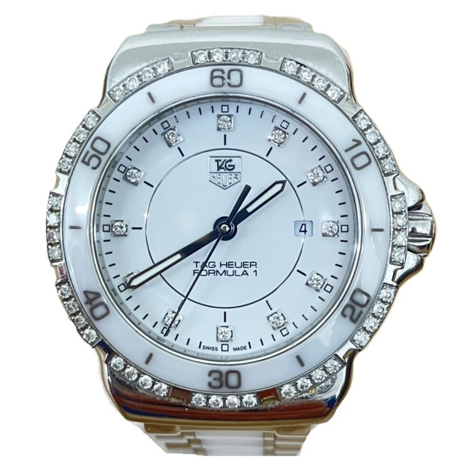 Wristwatch From Tag: Wristwatch From Tag Stainless steel case and band, the watch features a white dial. Its compact size of 32mm makes it suitable for smaller wrists. A reliable timepiece from Tag Heuer. Item Specifics: