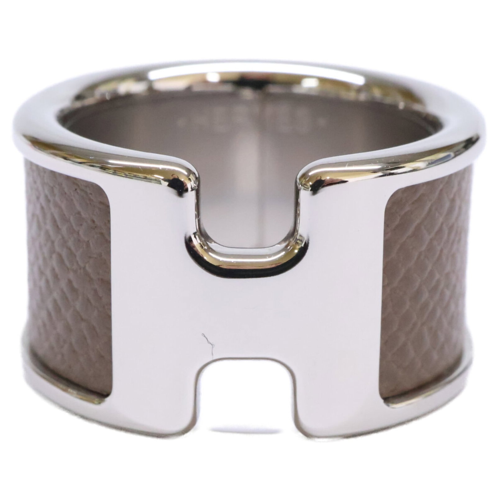 Metal Ring Band Hermes: Metal Ring Band Hermes Metal Ring Band Hermes in Etoupe Gray and Silver. This metal band ring features a sleek design with an etoupe gray finish and silver accents, adding a touch of sophistication