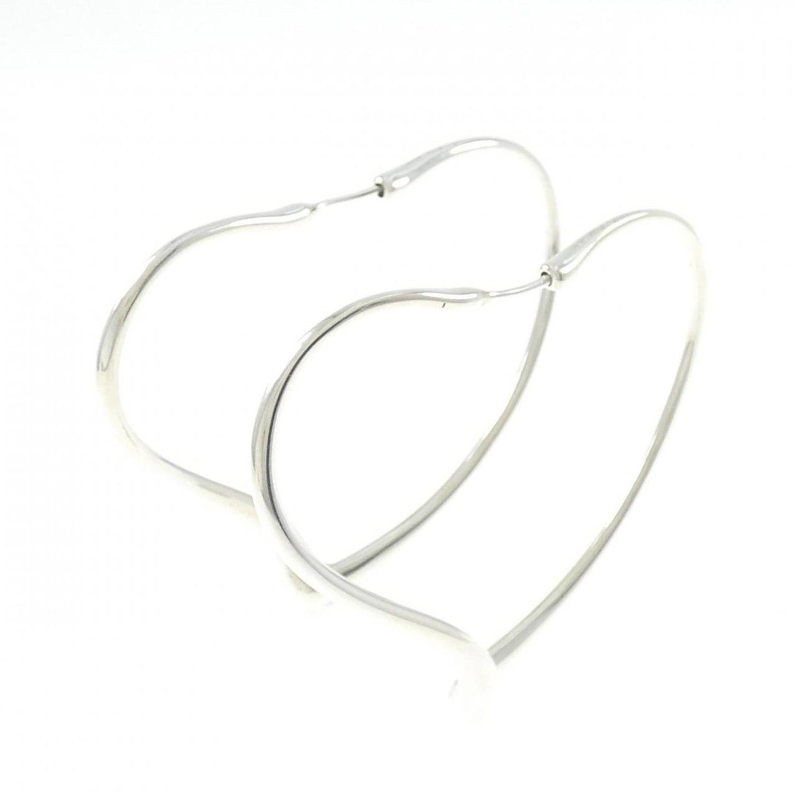 Hoop Earrings Silver By Tiffany: Hoop Earrings Silver By Tiffany Silver Hoop Earrings by Tiffany feature a sleek, modern design with a silver 925 material and a subtle weight. The earrings measure 46.30mm in length and 5.60mm in