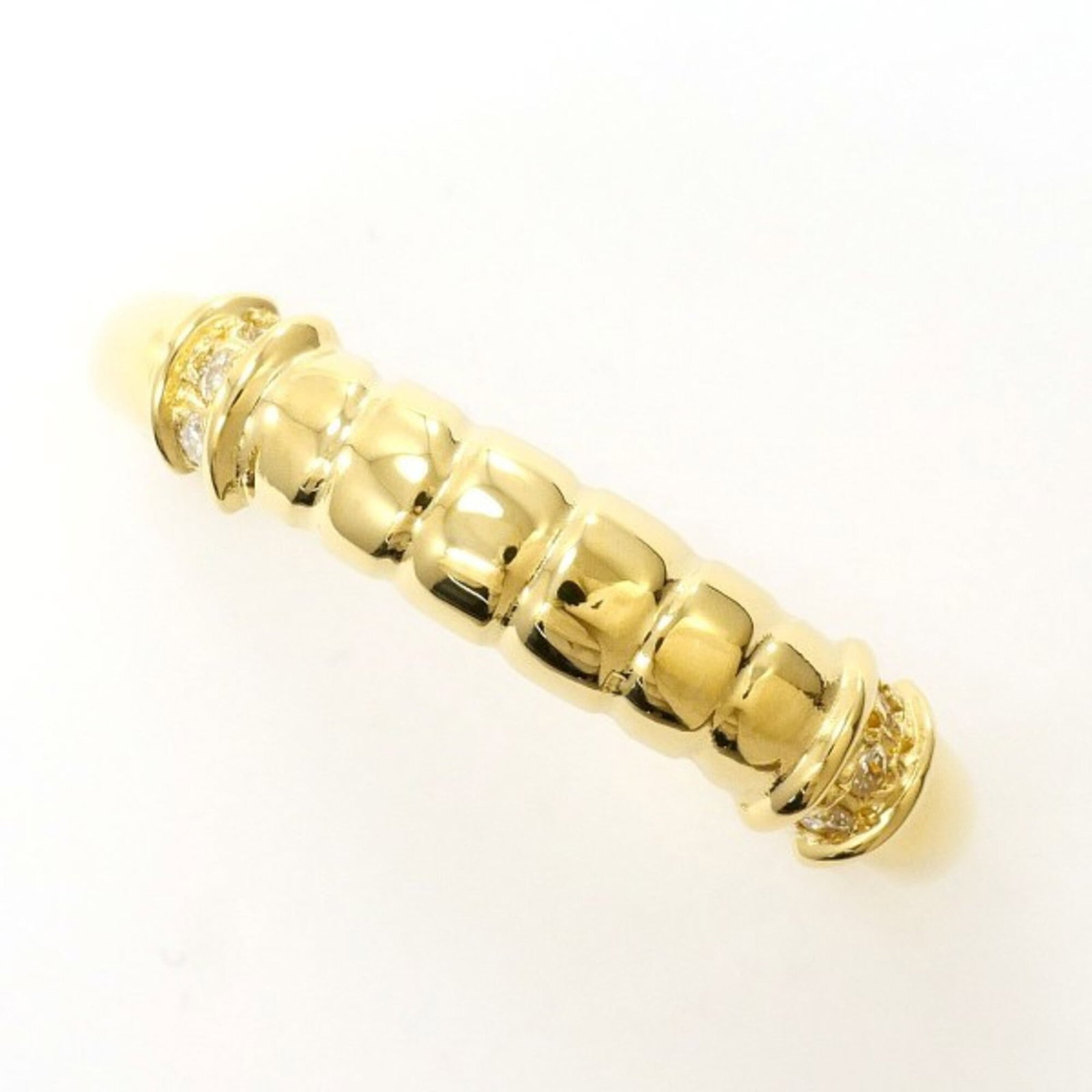 Unbranded Band Ring Yellow Gold (18K): Unbranded Band Ring Yellow Gold (18K) Yellow gold band ring with a diamond accent, featuring a sturdy 18K metal construction and a comfortable fit in size 6.5 US and 12 JP. Weighing 2.2g, this 4mm