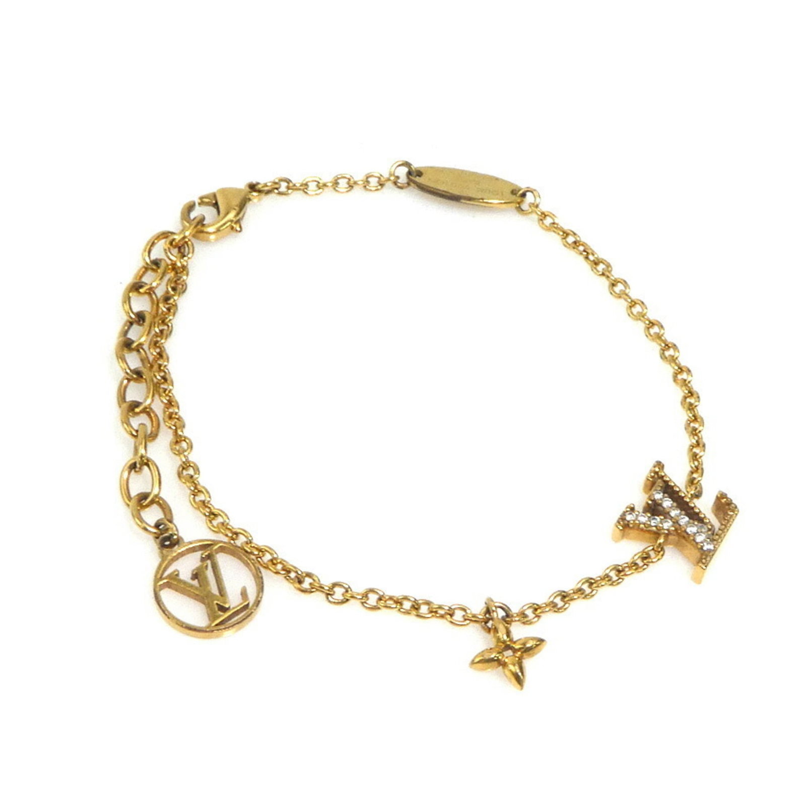 Metal Charm Louis Vuitton: Metal Charm Louis Vuitton Gold Metal Charm from Louis Vuitton, Italy. This charm bracelet measures 15.5cm in length and features the brand's signature metal design. A simple yet elegant accessory.