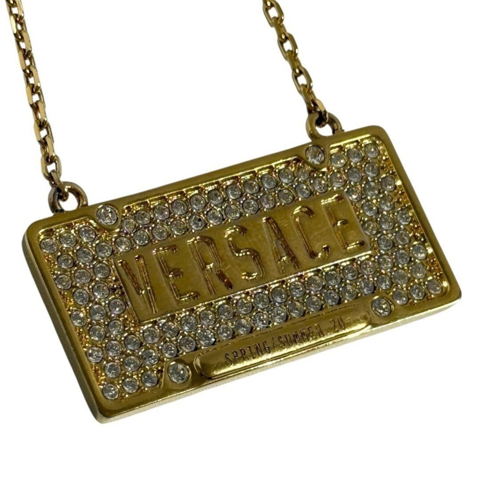 Men's pendant necklace plate motif from Versace 2020: Men's pendant necklace plate motif from Versace 2020 Metal, Rhinestone Pendant Necklace from Versace 2020 Features a plate motif design, showcasing the Italian brand's signature style. The necklace