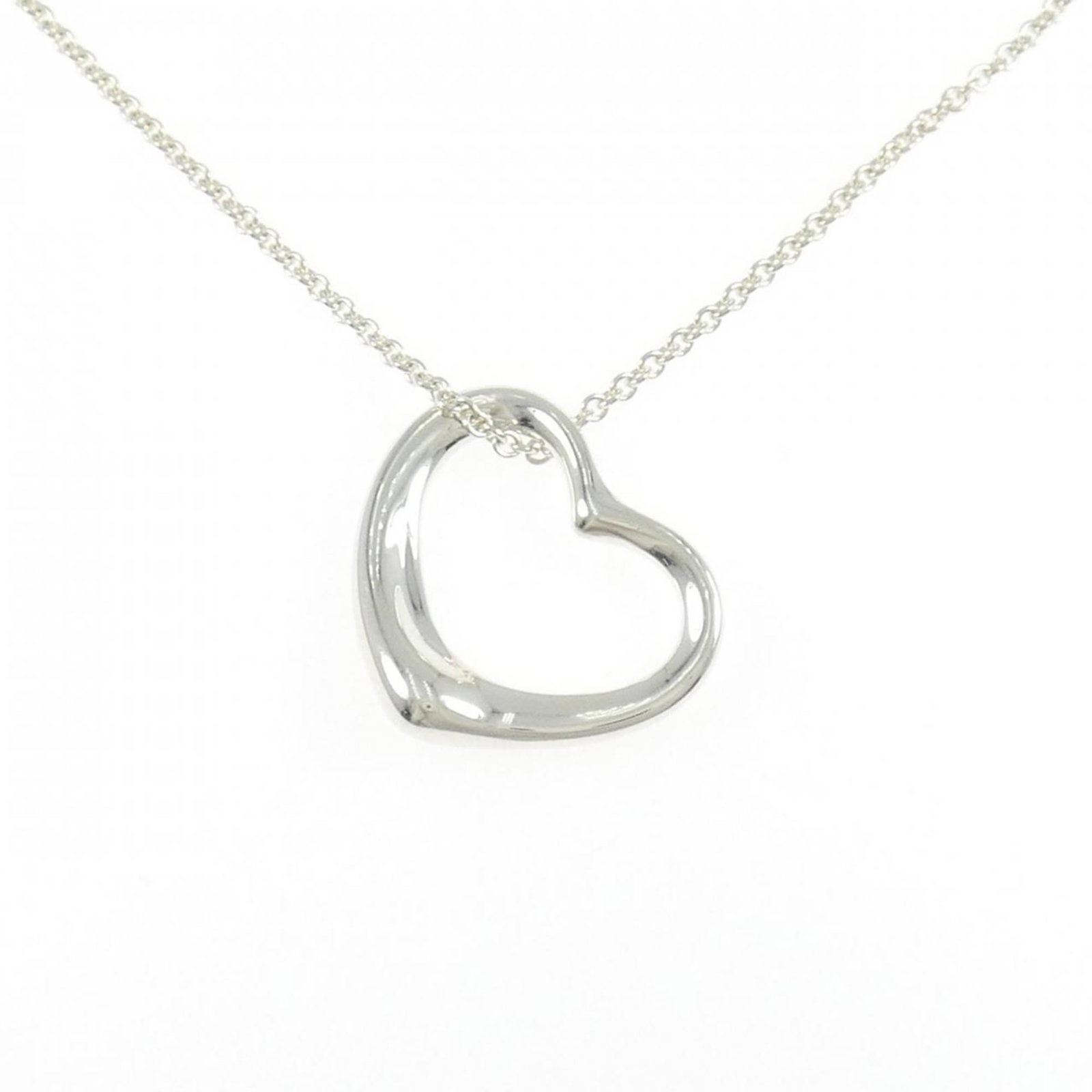Heart Necklace by Tiffany: Heart Necklace by Tiffany Silver Tiffany necklace with a pendant featuring a heart design, made from 925 sterling silver and measuring 20.4mm x 20.9mm. The necklace has a comfortable neck