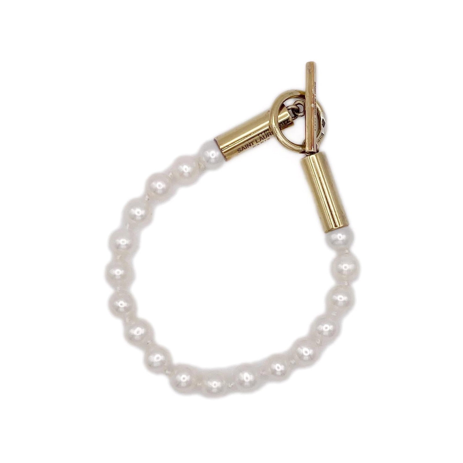 Laurent Saint Charm Silver 925 Bracelet: Laurent Saint Charm Silver 925 Bracelet Silver 925 charm bracelet from Saint Laurent, featuring a white pearl stone and measuring 15.5cm in length. The delicate 6mm wide chain adds a touch of