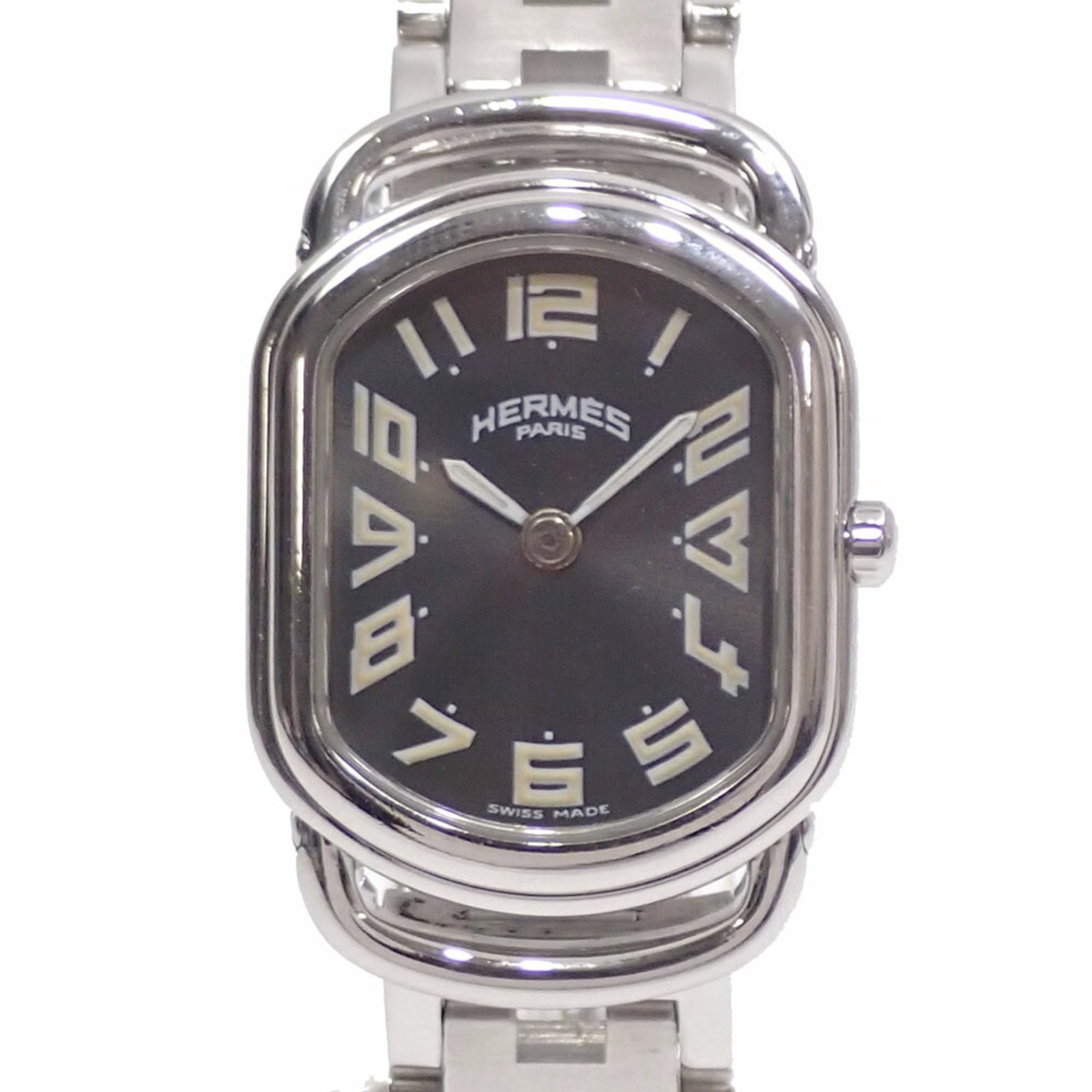 Hermes Wristwatch: Hermes Wristwatch Stainless steel case and band add a sleek touch to this quartz-powered wristwatch, featuring a gray dial. The compact 20mm case diameter makes it suitable for smaller wrists,