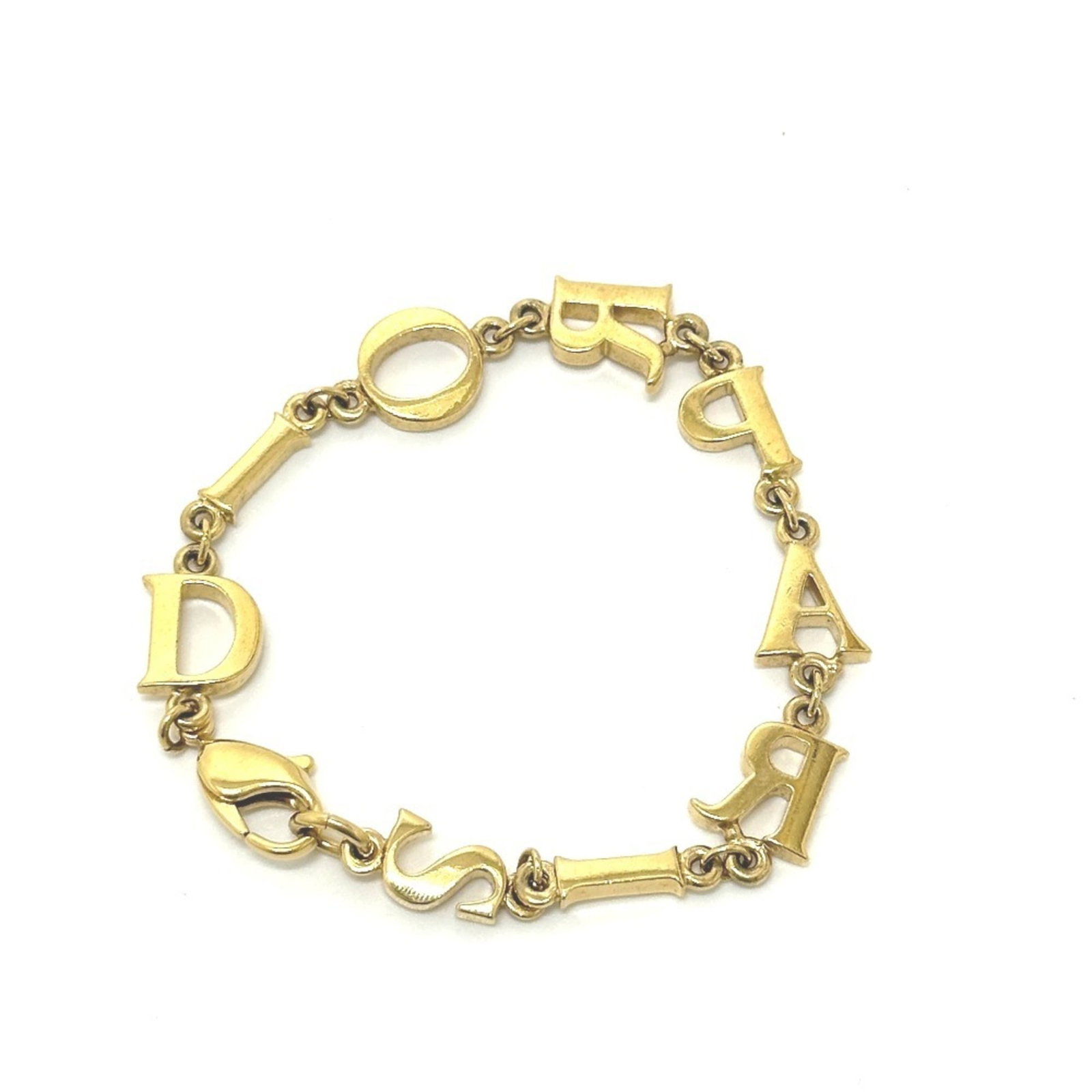 Metal bracelet Charm Christian Dior: Metal bracelet Charm Christian Dior Metal bracelet Charm Christian Dior features a gold metal design with a notable charm. The charm is attached to an 18cm long chain, making it a stylish accessory