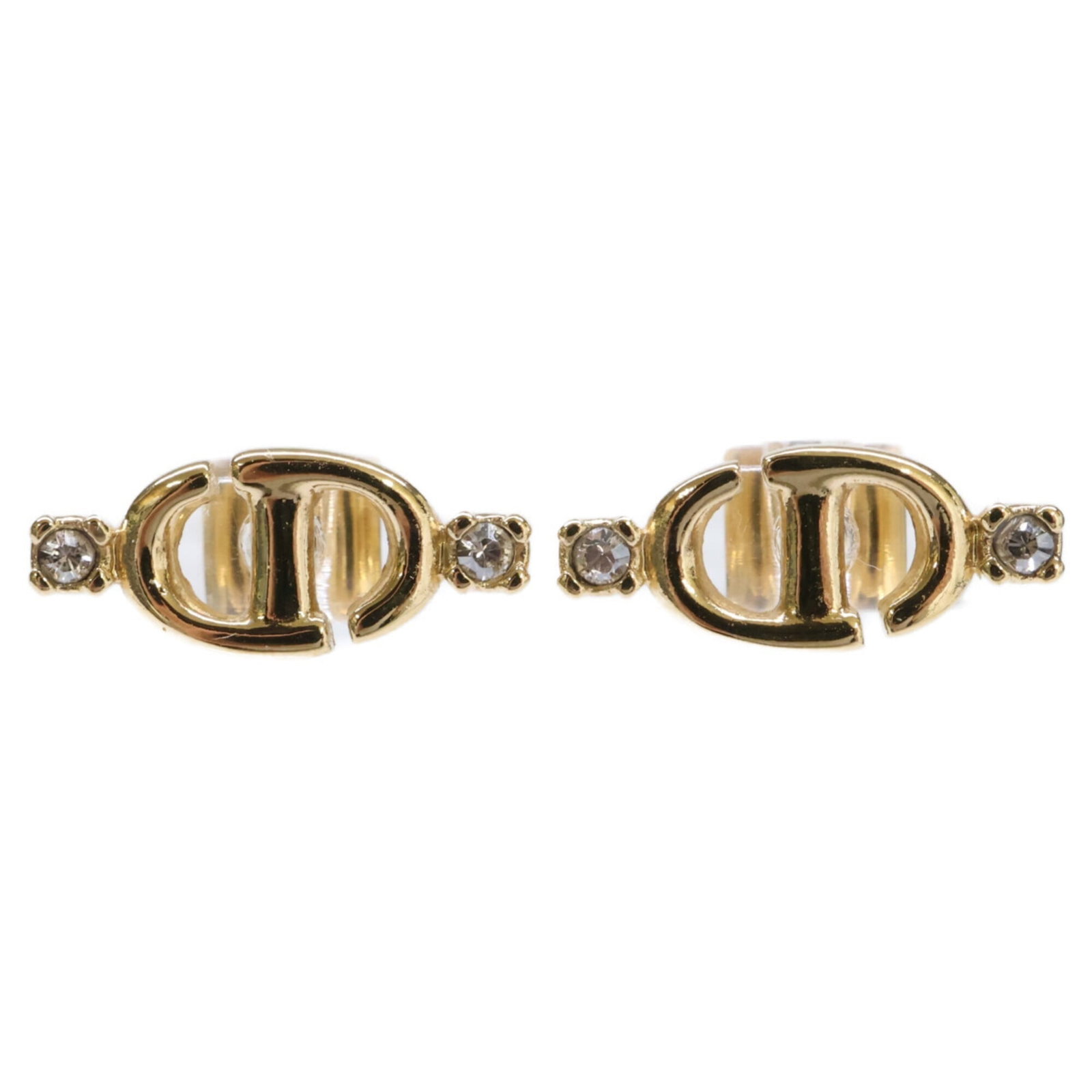 Metal Christian Dior Stud Earrings: Metal Christian Dior Stud Earrings Metal Christian Dior Stud Earrings in Gold. These small, elegant earrings feature the iconic Christian Dior brand and are crafted from metal with a gold finish. Meas
