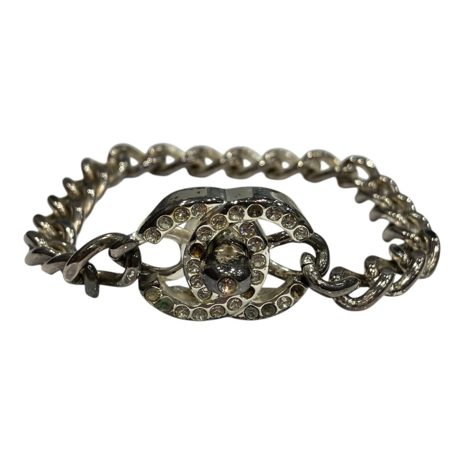 Charm bracelet of brass: Charm bracelet of brass Brass charm bracelet with a sleek design, measuring 16.5cm in length, bearing the iconic Chanel brand name. This elegant accessory features no additional accessories and