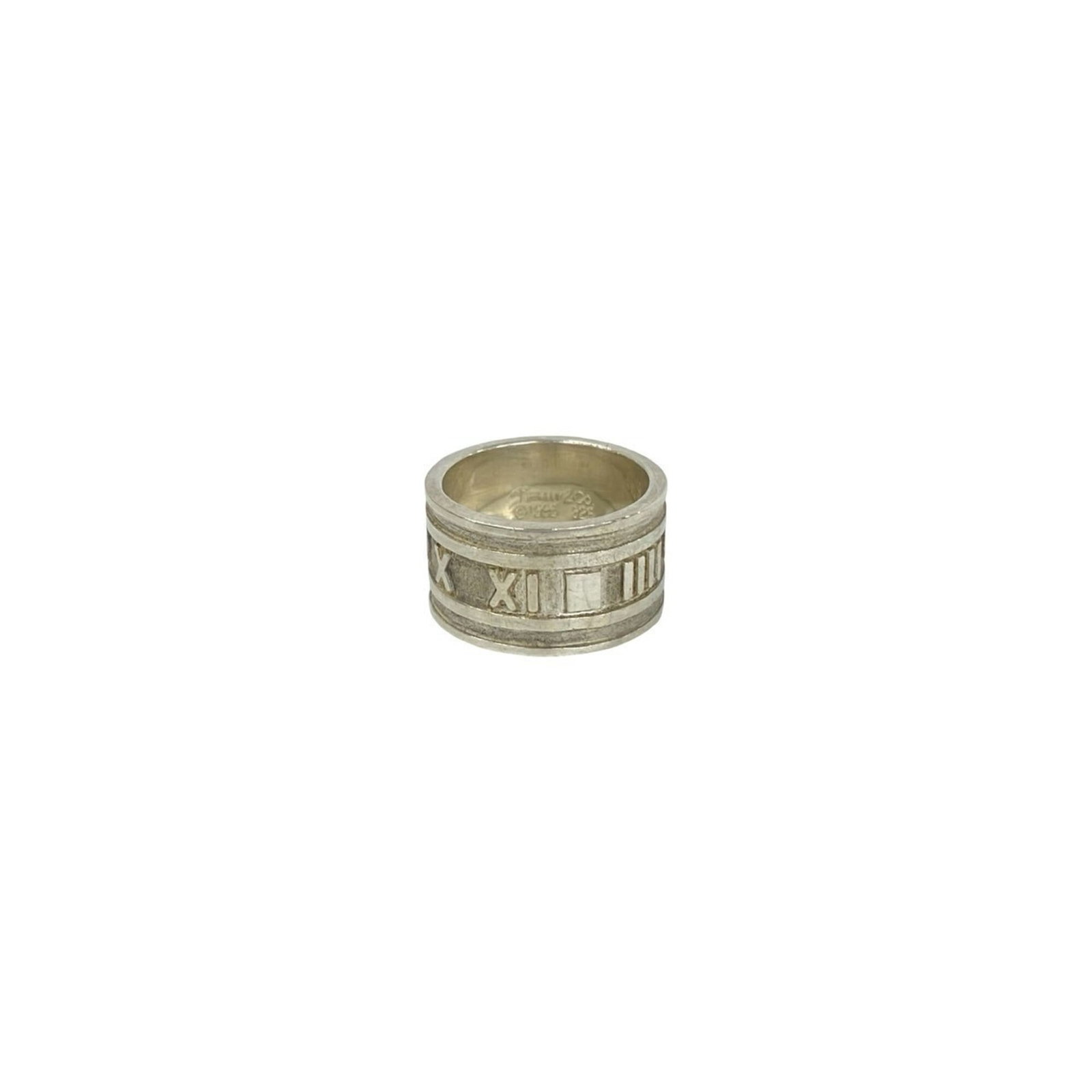 Silver 925 Tiffany Band Ring: Silver 925 Tiffany Band Ring Silver 925 Tiffany Band Ring features a sleek band design made from high-quality silver material, bearing the hallmark of Tiffany's craftsmanship. This women's ring is