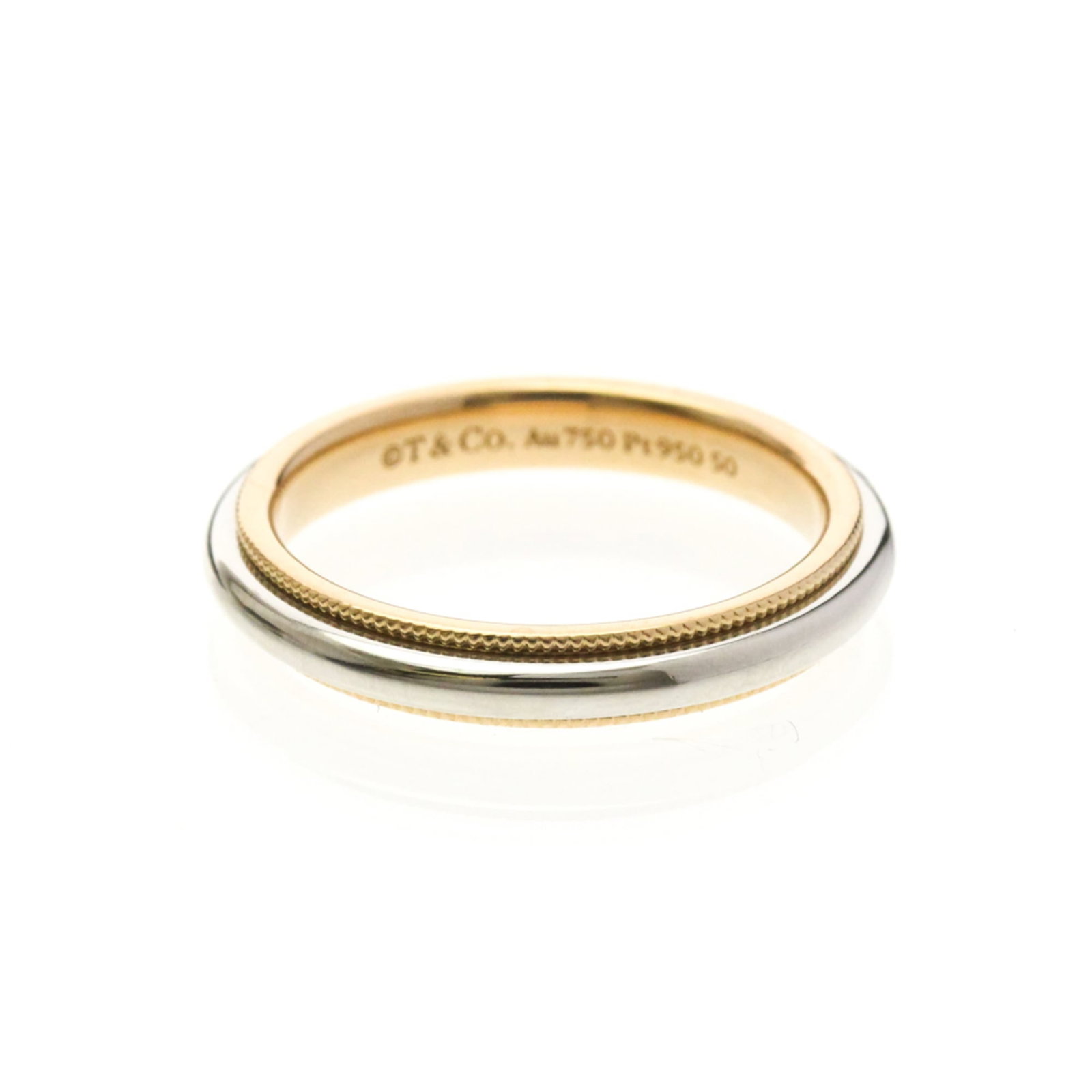 Pink Gold Tiffany Band Ring Platinum: Pink Gold Tiffany Band Ring Platinum Pink gold Tiffany band ring in platinum, featuring a classic milgrain design. This elegant ring boasts a striking pink gold hue and slender profile, making it a