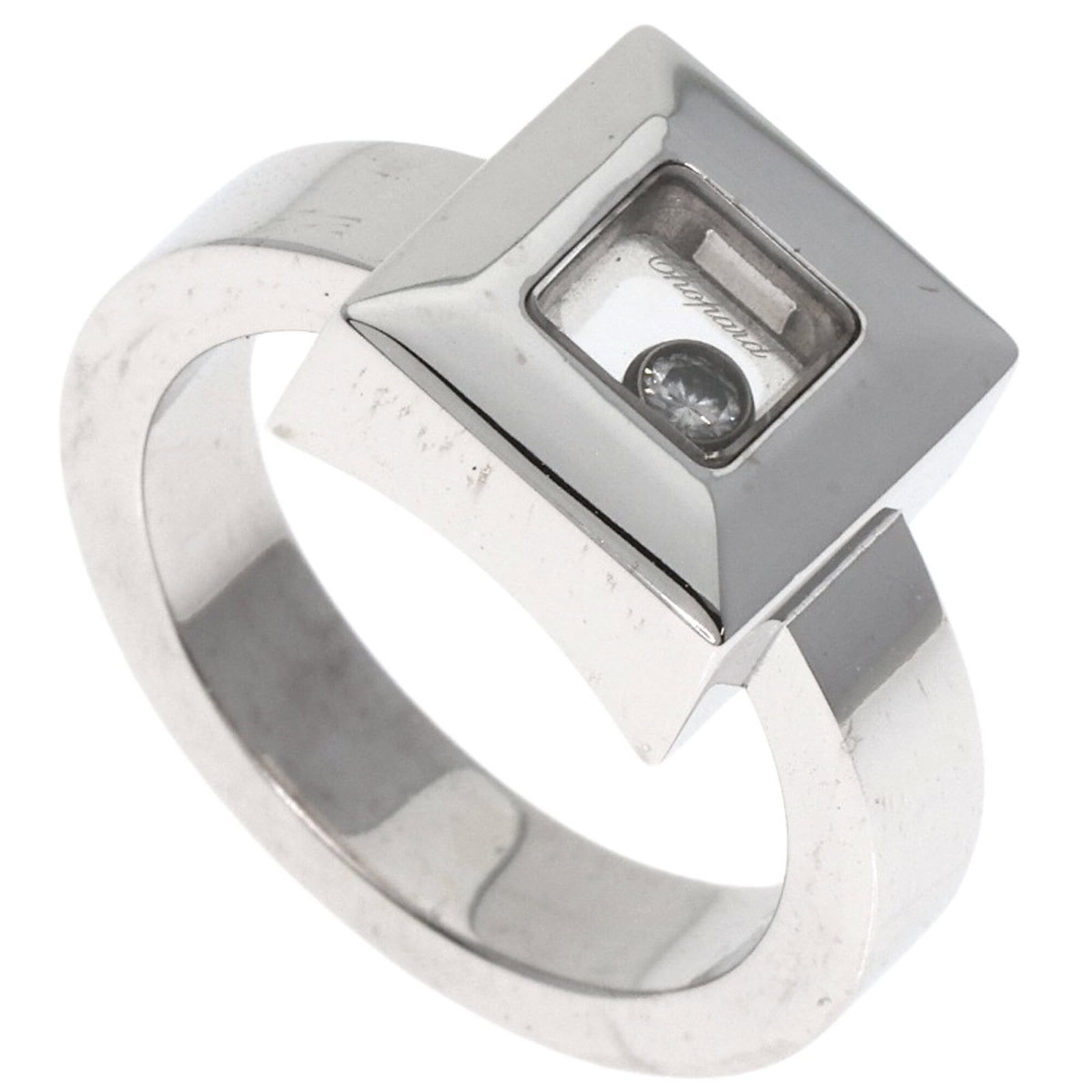 Chopard Band Ring White Gold (18K): Chopard Band Ring White Gold (18K) Chopard's iconic band ring showcases its elegant design in 18K white gold, complemented by a diamond stone. Available in US size 5 and Japanese size 9, this piece